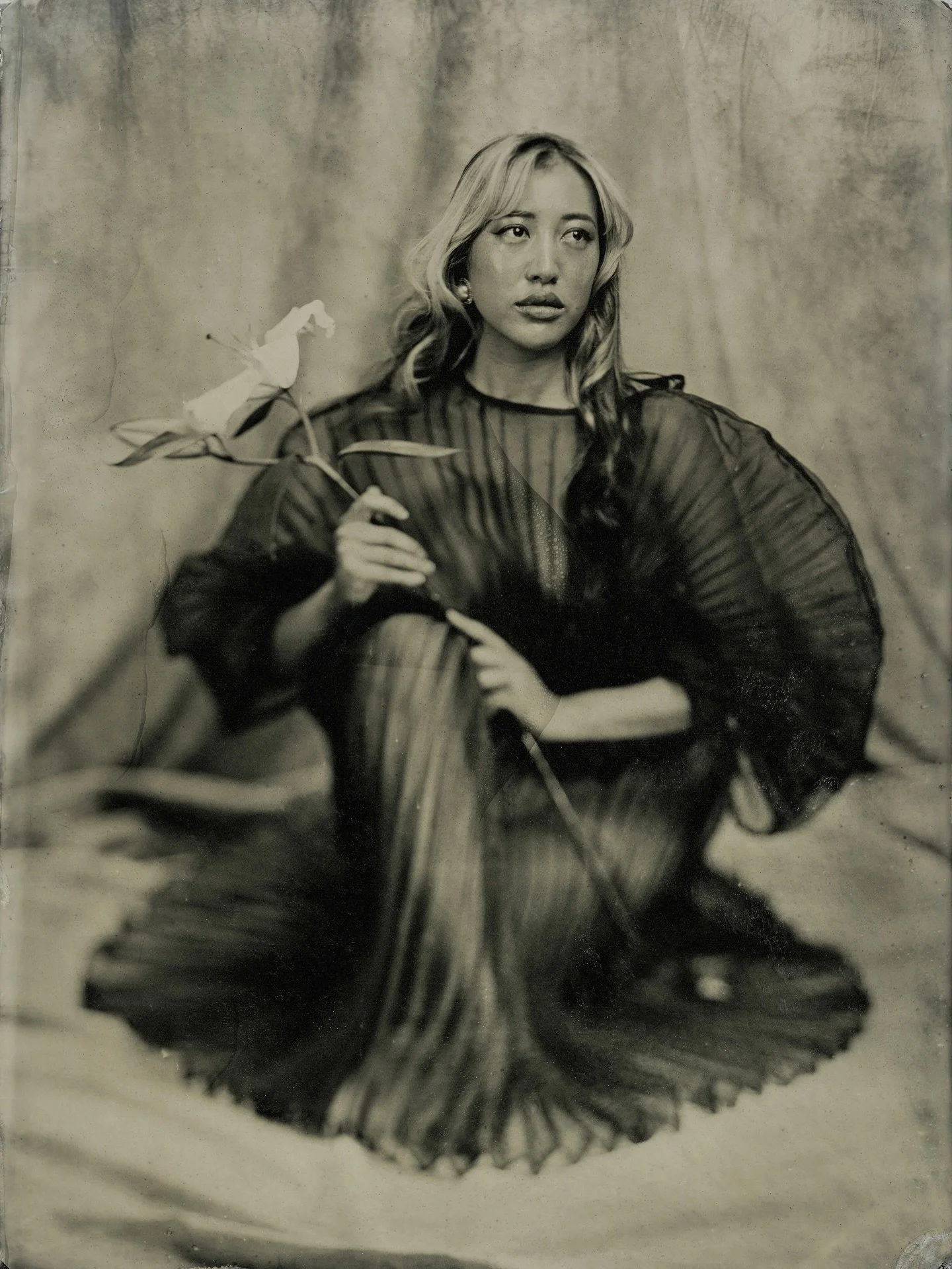 Some portraits just flow naturally, and this was one of them. Aubrey came to the studio with a vision: the outfit, the flower, the pose. All I had to do was set the stage and let the tintype do its magic.
I love when people bring their own ideas and