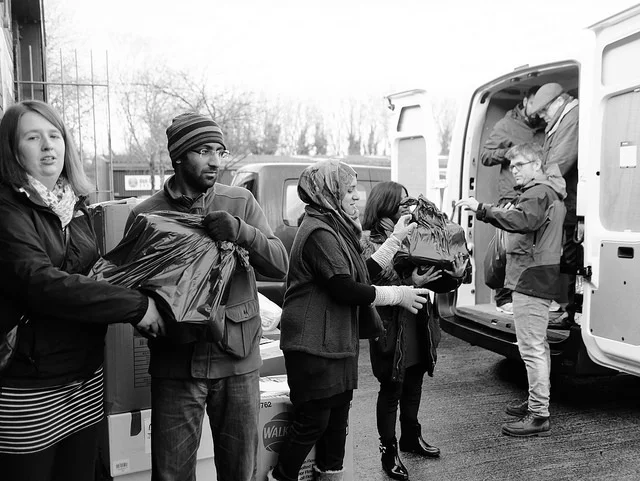 Volunteers helping to load vans for our third aid convoy to the Calais and Dunkirk refugee camps in February 2016.