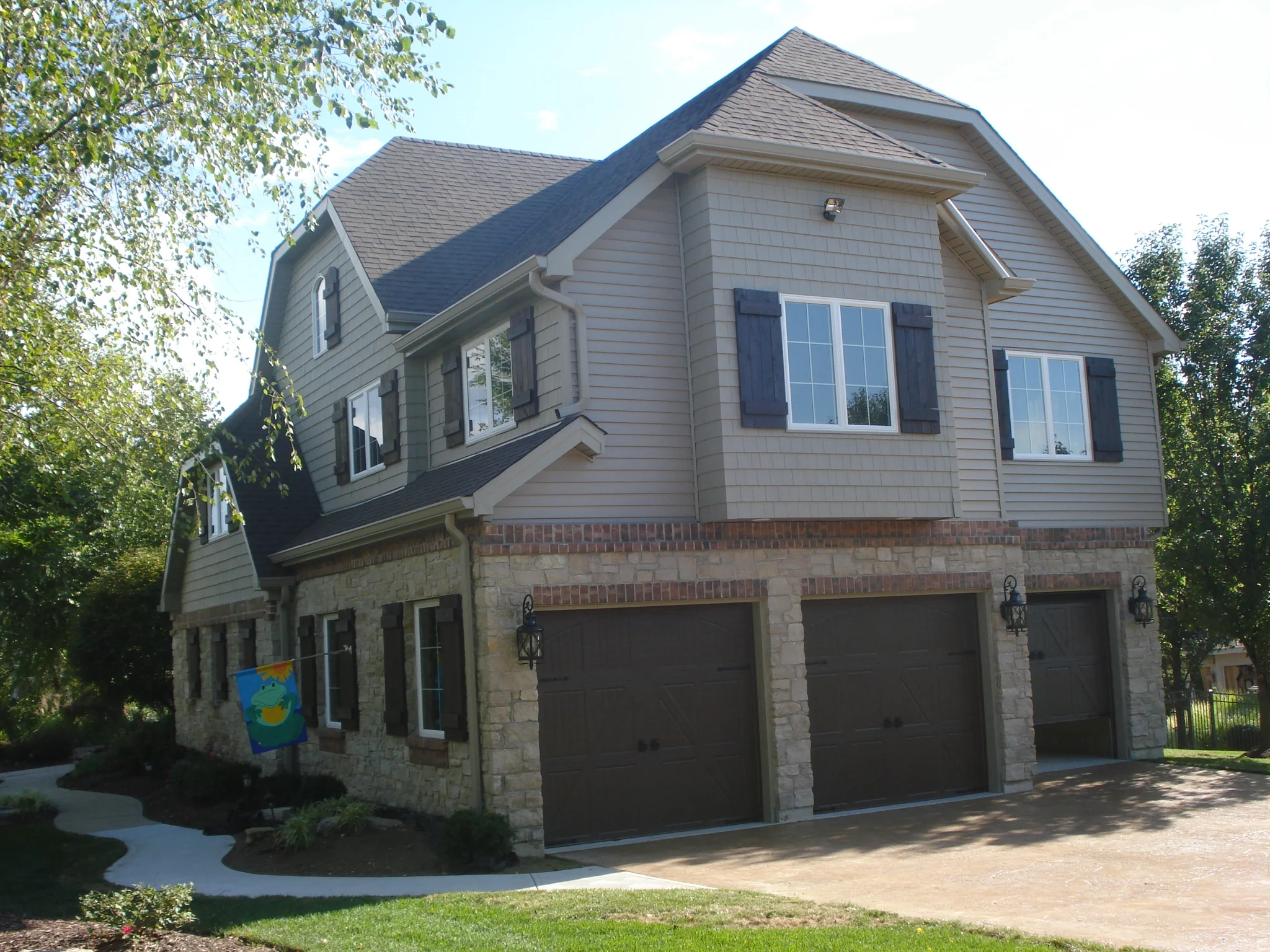 Second floor addition includes expansion of garage two cars deep.