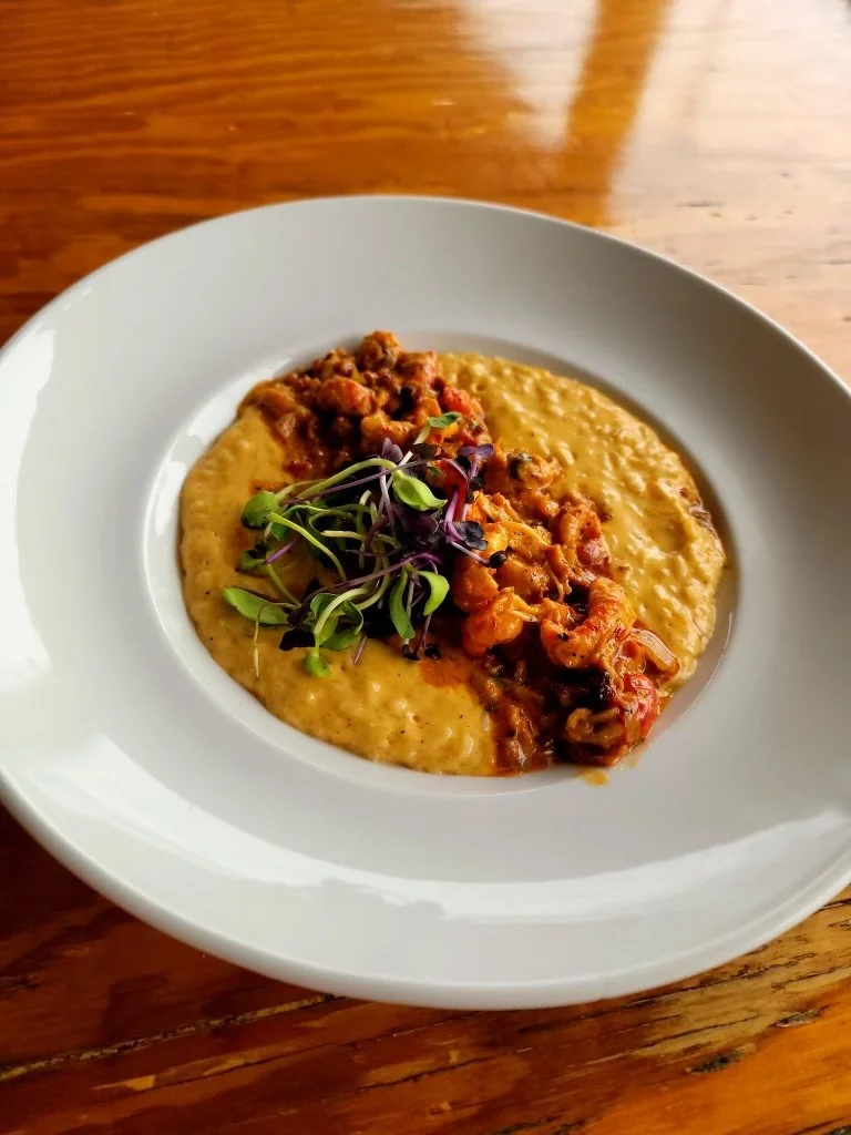 Field to Feast: Blackened Crawfish with Spicy Bacon Butter on Popcorn Rice Grits with Crawfish Town USA