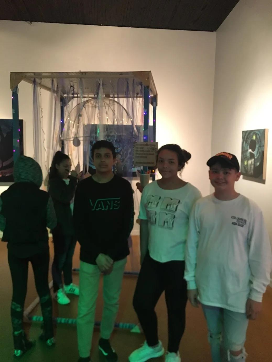 Students exhibiting their art project “shower of courage”