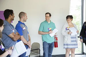 Brian Alvo, center, and Lisa, right, at a NextGen Center event.