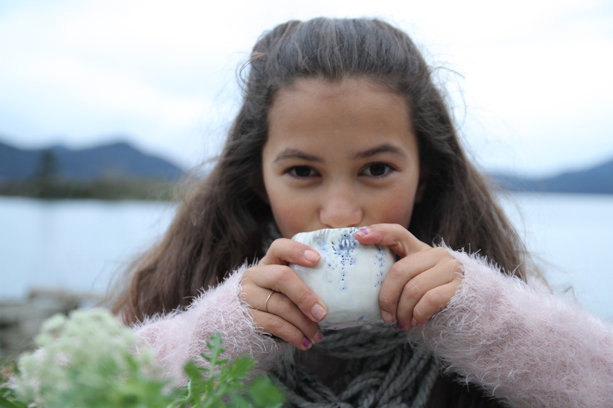 Isabella enjoying a warm cup of tea at our winter picnic. Photo by Gray G.