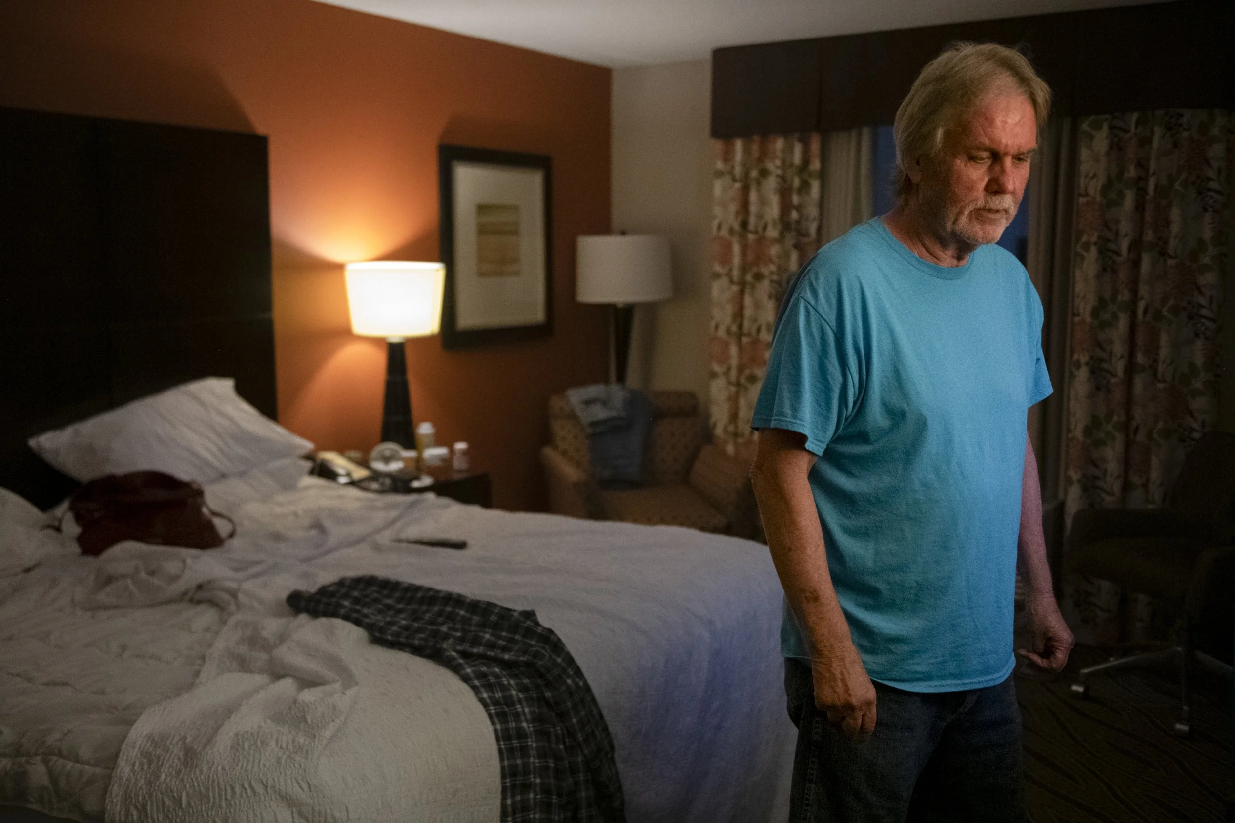  John Hart II stands in a Hampton Inn hotel room after being displaced from his home due to a house explosion at 1010 N. Weinbach Ave., in Evansville, Ind., on Aug. 11, 2022. The Hampton Inn is hosting a few families unable to return to their homes. 