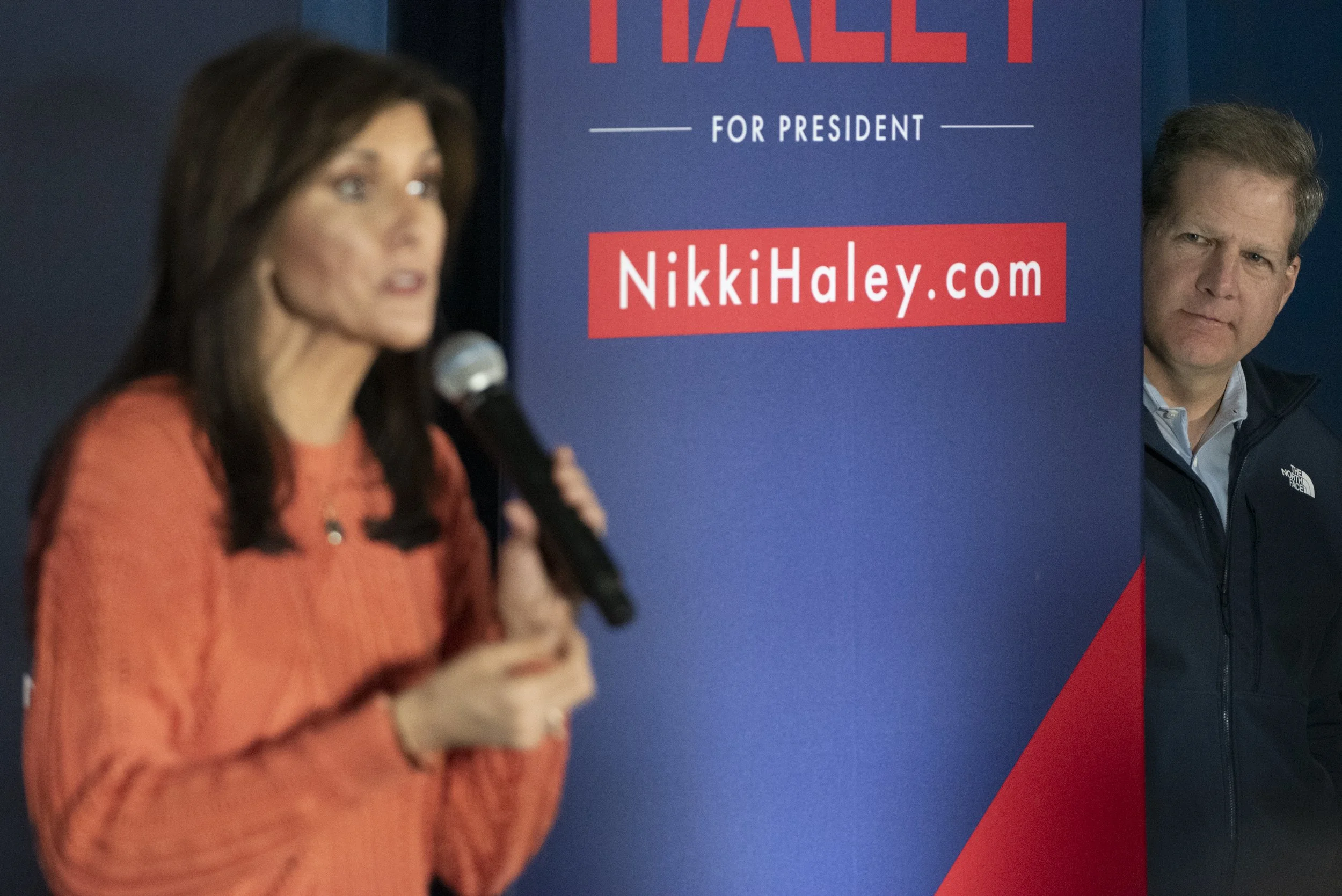  N.H. Governor Chris Sununu listens to Nikki Haley speak at  a campaign event a day before the state primary at the Veterans of Foreign Wars (VFW) in Franklin, N.H., Jan. 22, 2024. Despite Sununu’s endorsement, Donald Trump won the New Hampshire Repu
