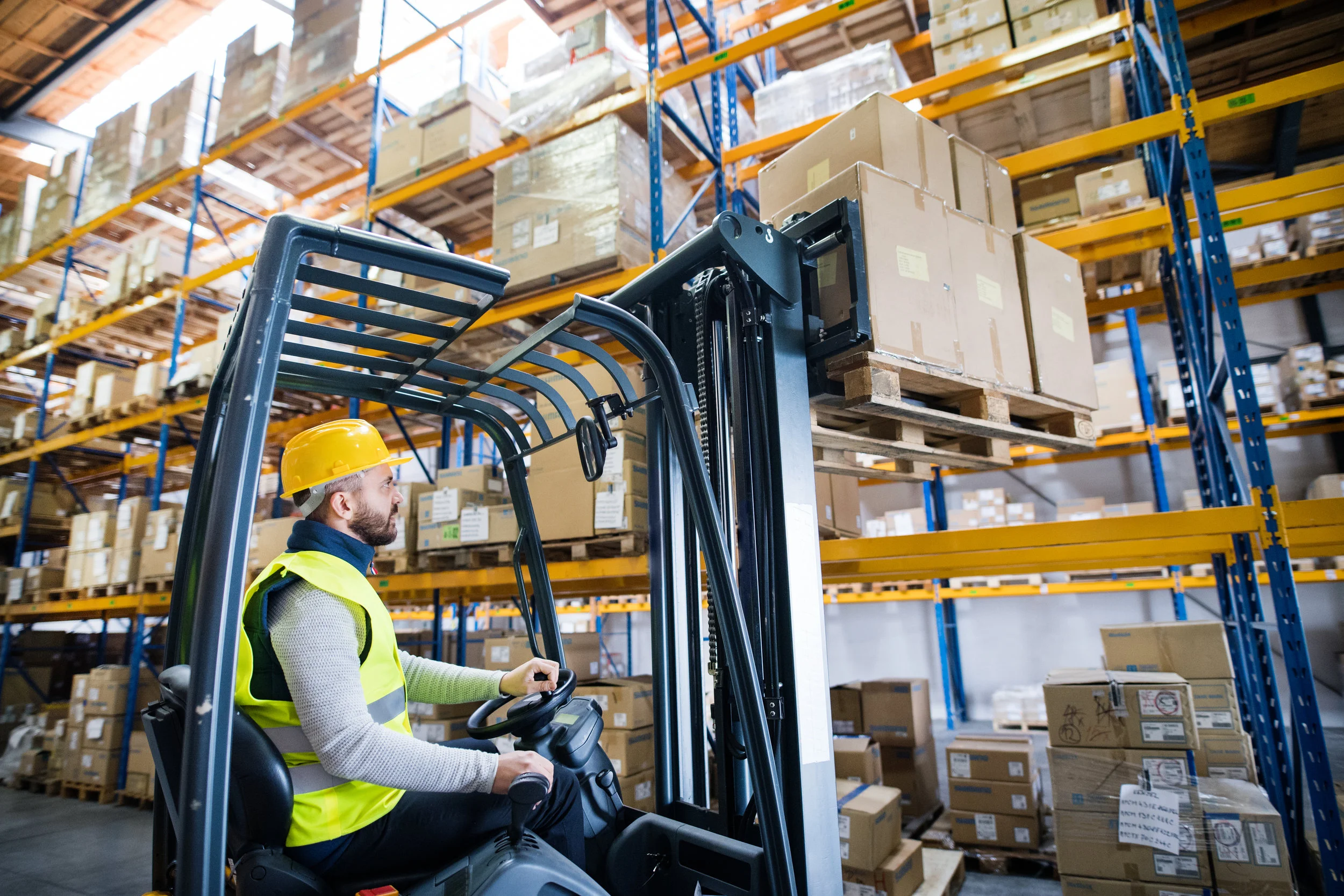 warehouse-man-worker-with-forklift-PFBRL67.jpg