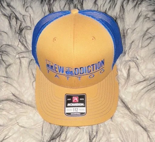 NA Tan and Blue Trucker Hat.jpg