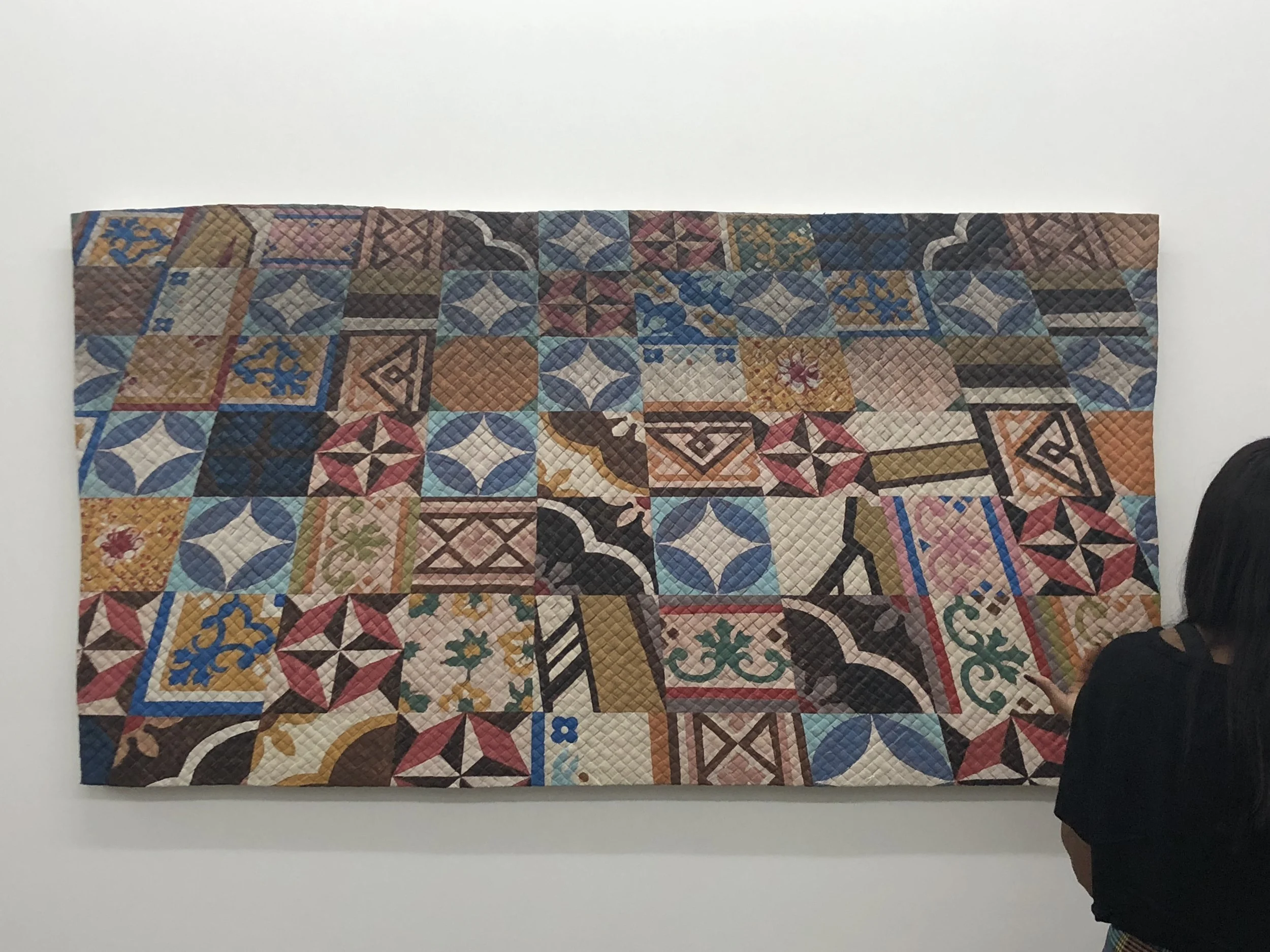 Tegel Buitenzorg, 2018 acrylic paint and oil paint on hand woven pandan leaf, 41 x 77 inches.