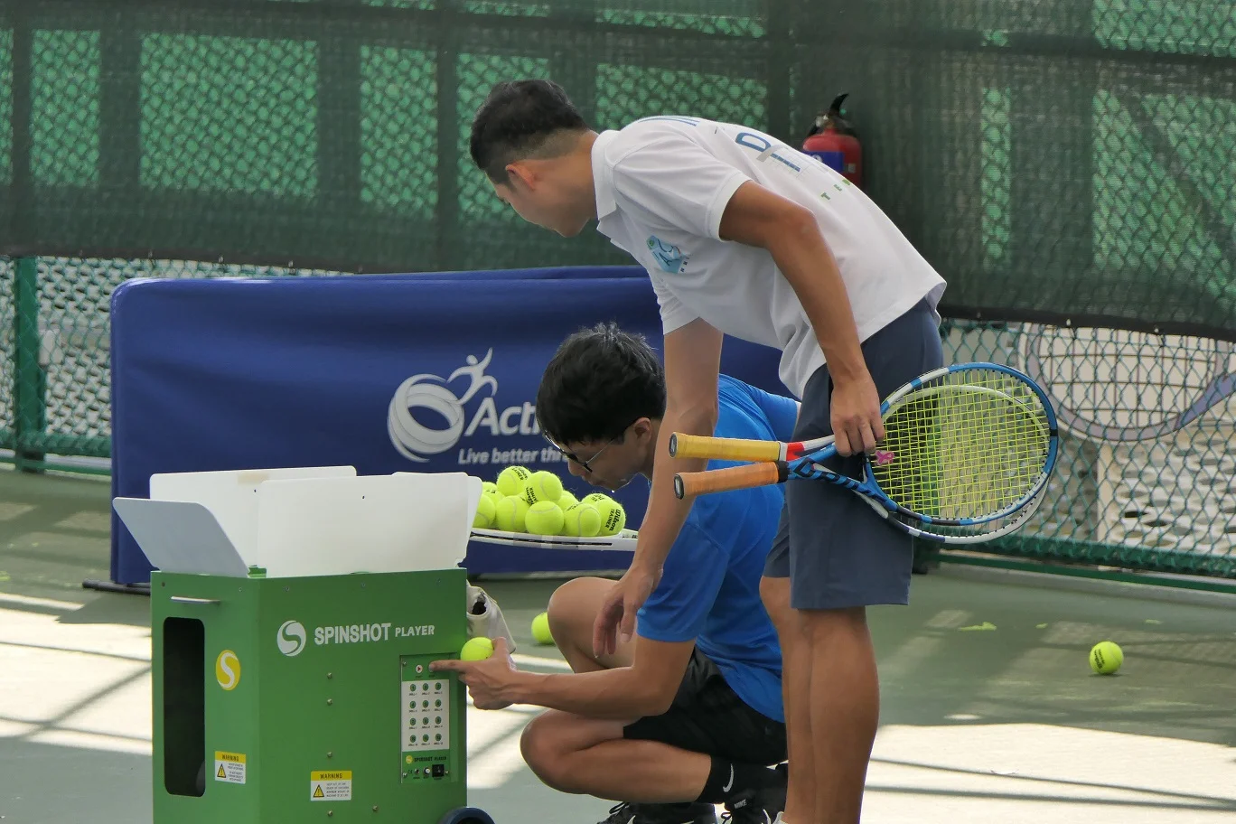 Tennis Lessons Singapore Ball Machine