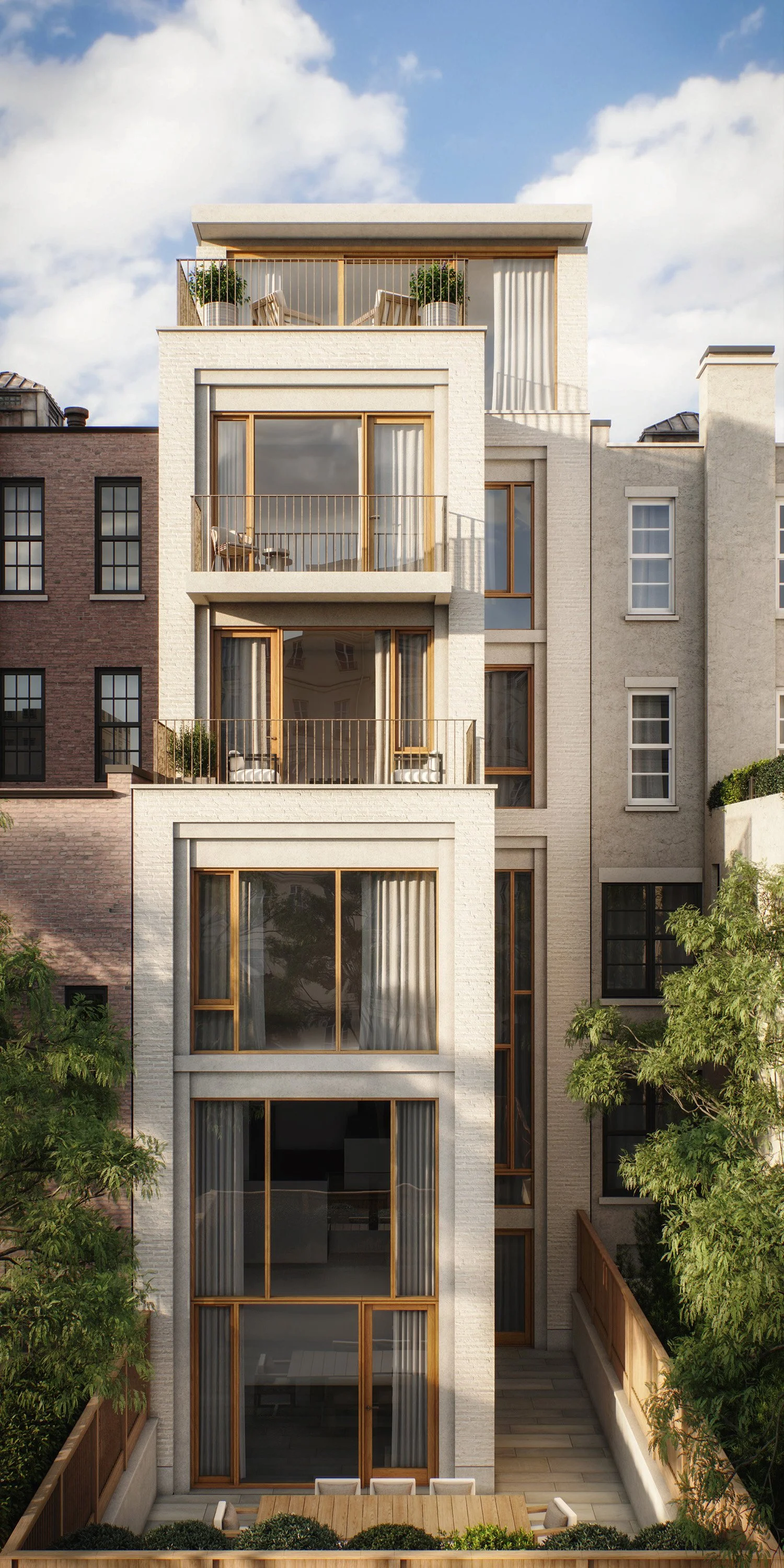 Modern multi-story apartment building with large glass windows, balconies, and potted plants on top floor, surrounded by greenery under a partly cloudy sky.