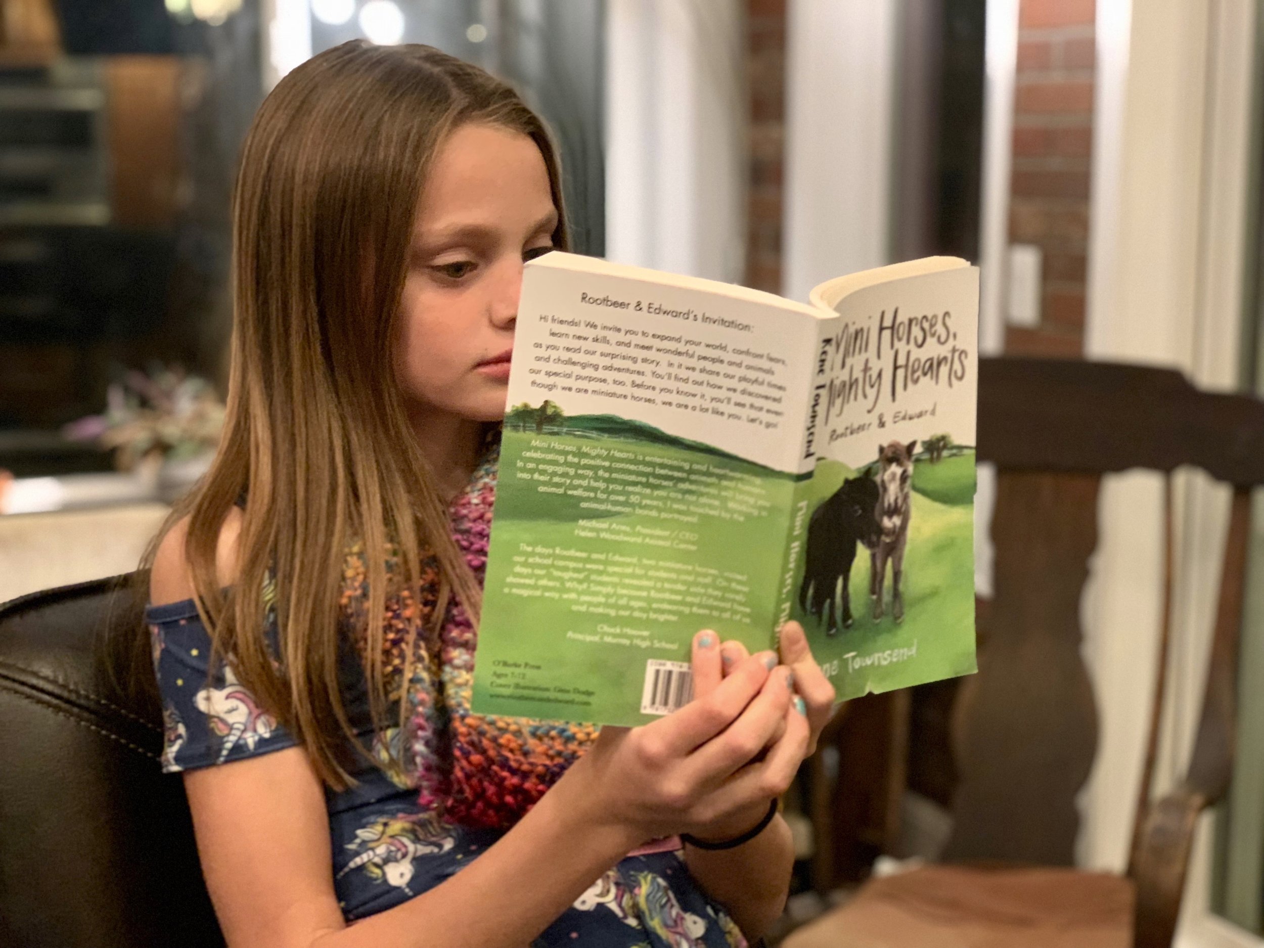 MH_MH_being_read_by_young_girl.jpg