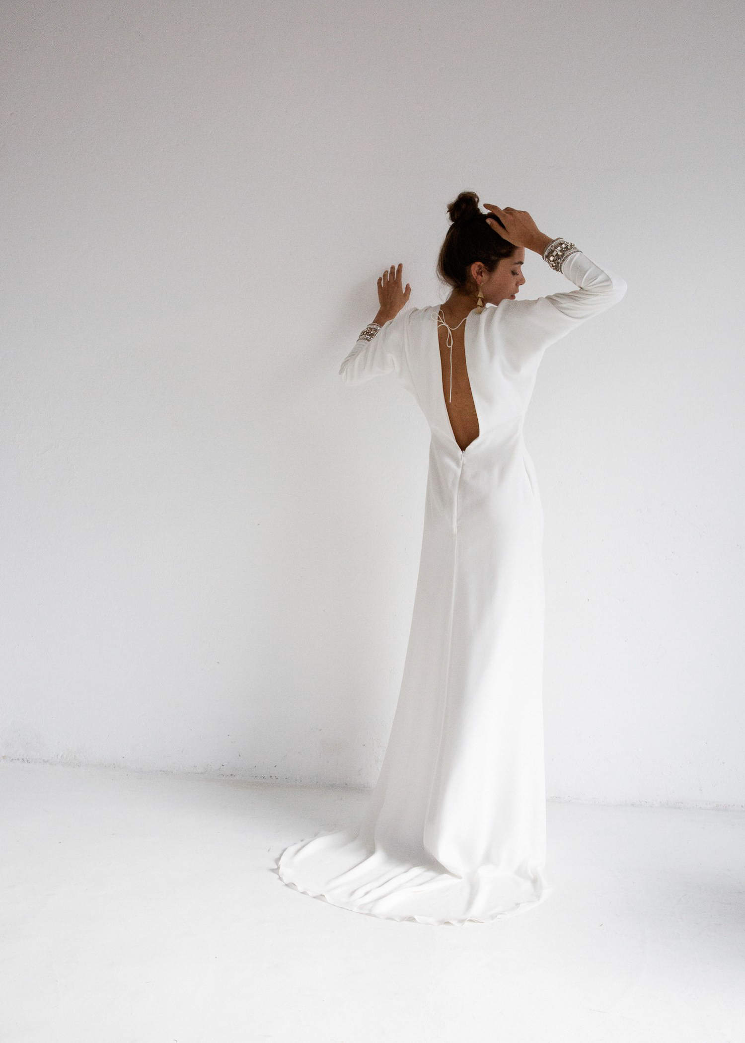 MAE GOWN – The MAE wedding gown is an iconic piece from our new TEMPLE collection. A Bo & Luca team favourite, the MAE gown has been crafted from the finest crêpe silk, which has been hand-dyed in a loose leaf white tea to lend the fabric its creamy hue. The cuffs of this gown have been delicately hand-beaded, using champagne gold and cognac-coloured stones and beads. The gown has a low-V front and back, with the front waist knotting at the waistband, while the skirt is a semi-fit and flare with a front split.