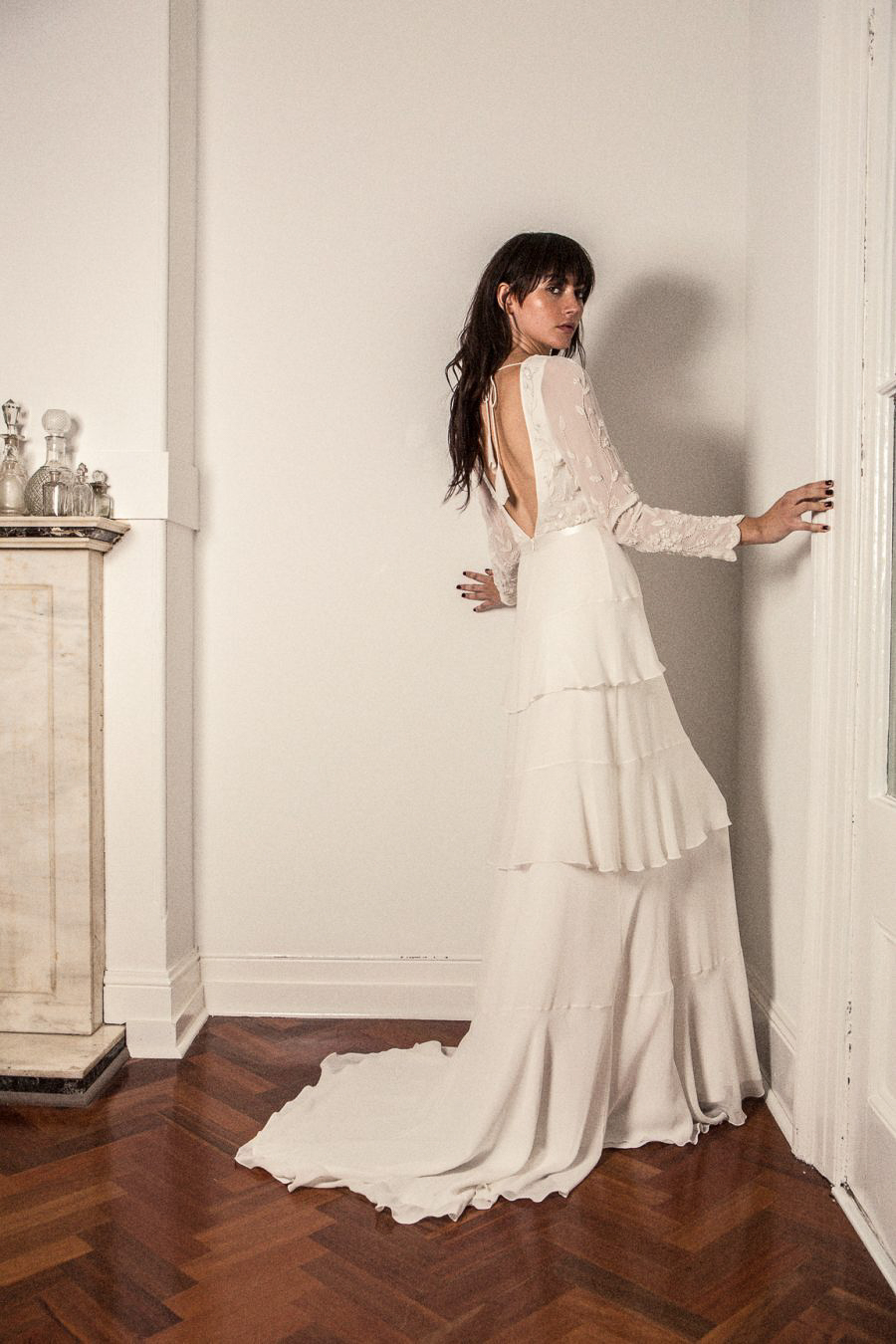 PRIMROSE GOWN – The exquisite PRIMROSE gown is a Bo & Luca team favourite . This elegant gown features an entirely hand beaded bodice with a demure high neckline and low round back. The gown long beaded sheer sleeves and a cascading tiered skirt made from the finest sheer silk chiffon.