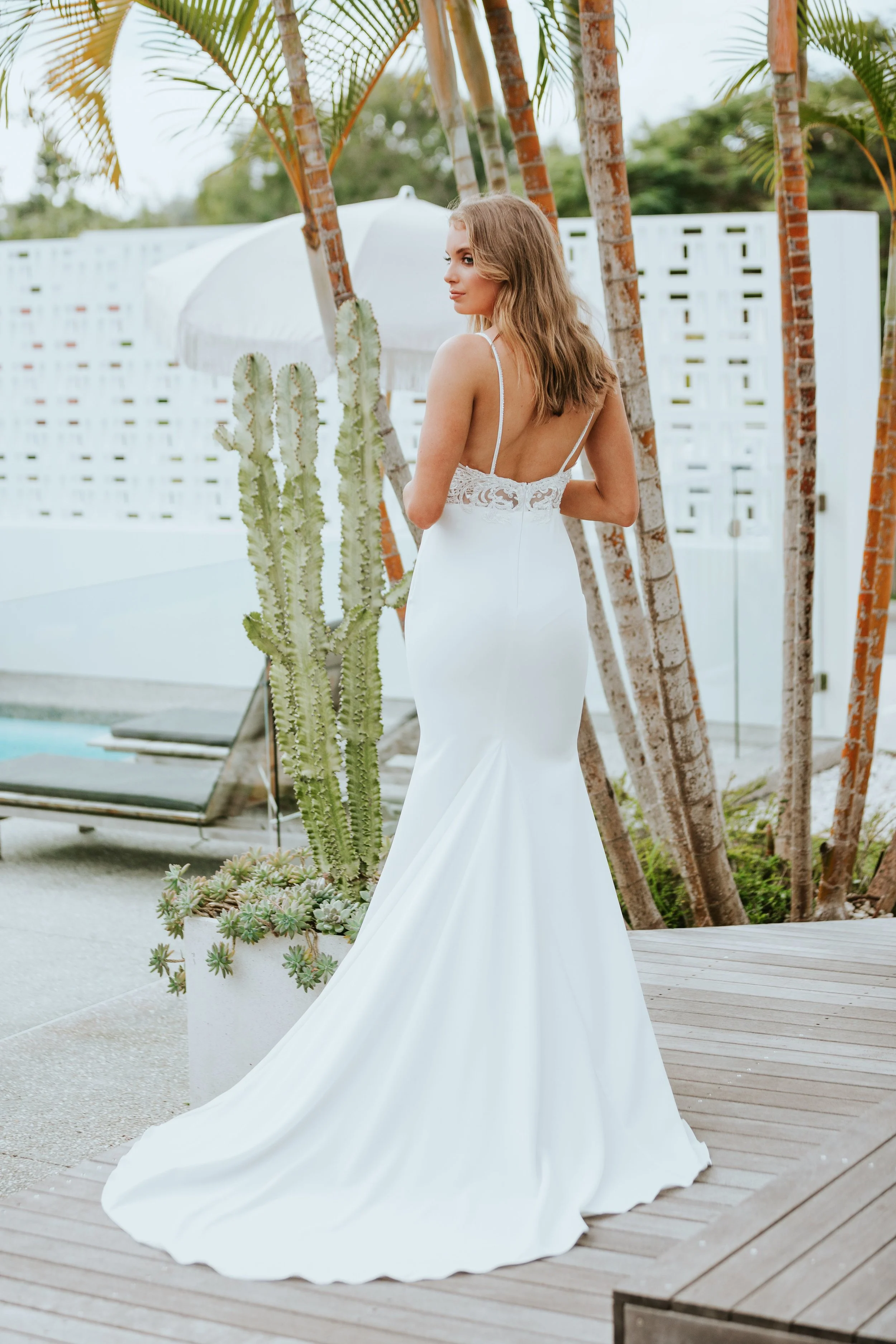 The CAPRI gown was made using a sparkling sequin and lace applique, hand-sewn onto the bodice for a unique luxe look. CAPRI is a divine gown that highlights your natural curves, hugging the hips with a soft, smooth matte French crepe.