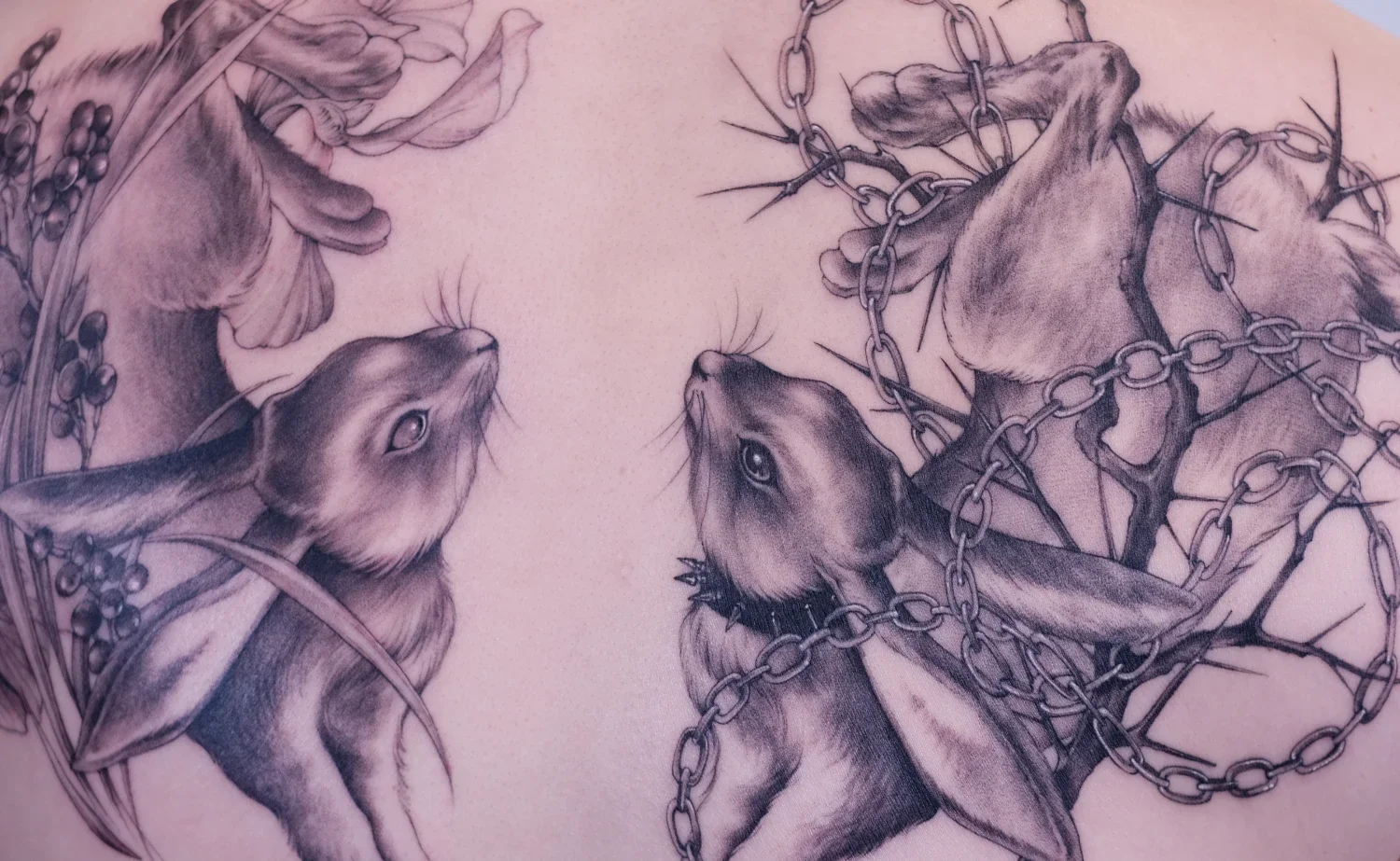Fineline tattoo of two opposite DND inspiredbunnies.