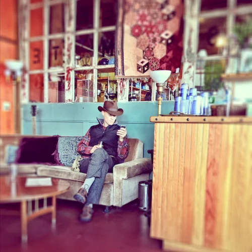 Working in a coffee shop.