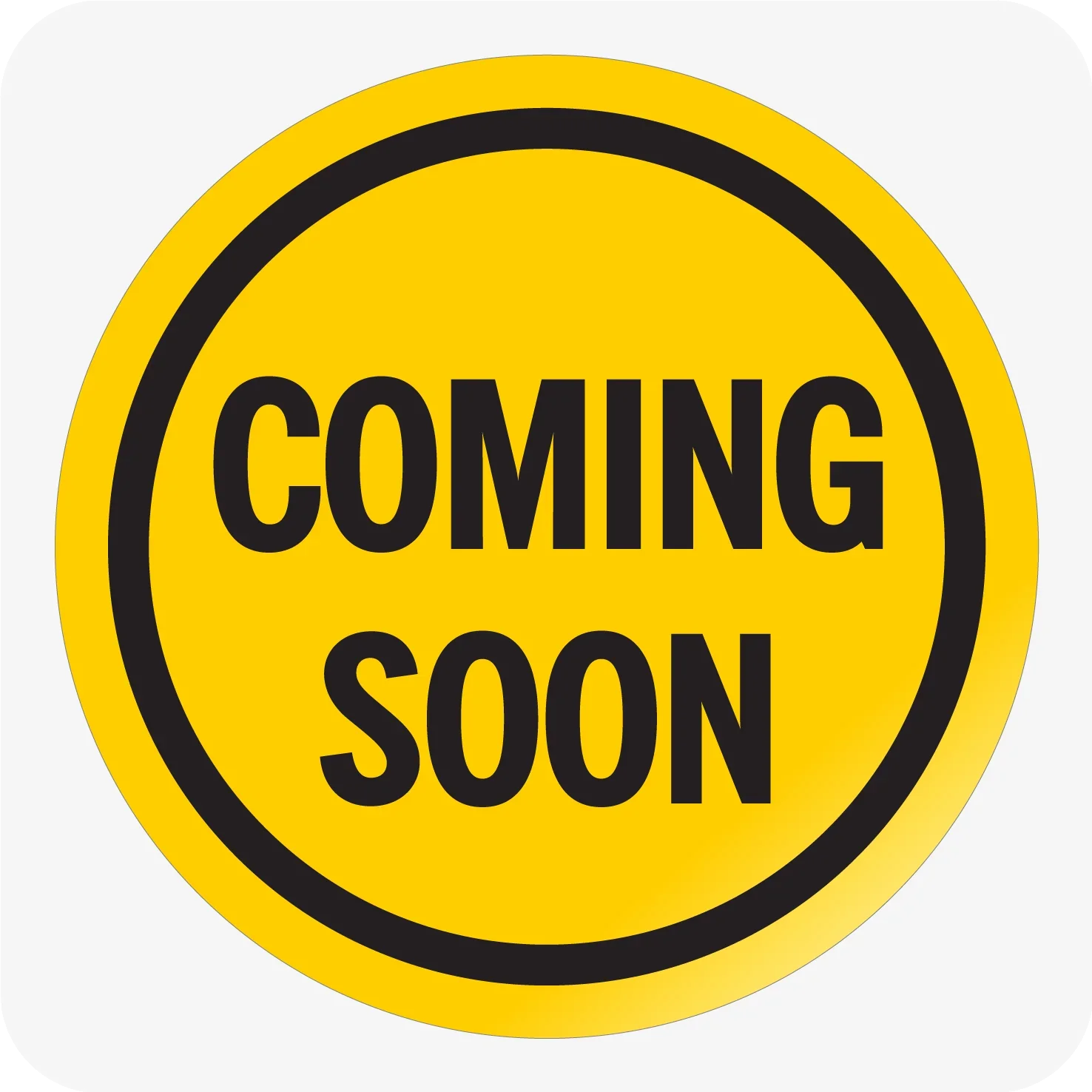 Yellow circular sign with black borders and text that reads "Coming Soon."