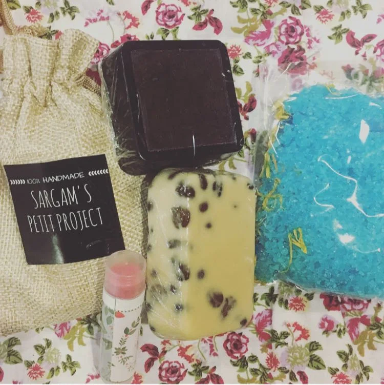 Jute Foot soak gift bag, Strawberry lip balm, Coffee lavender body bar, Ylang -Ylang foot soak, Charcoal rose soap. 
