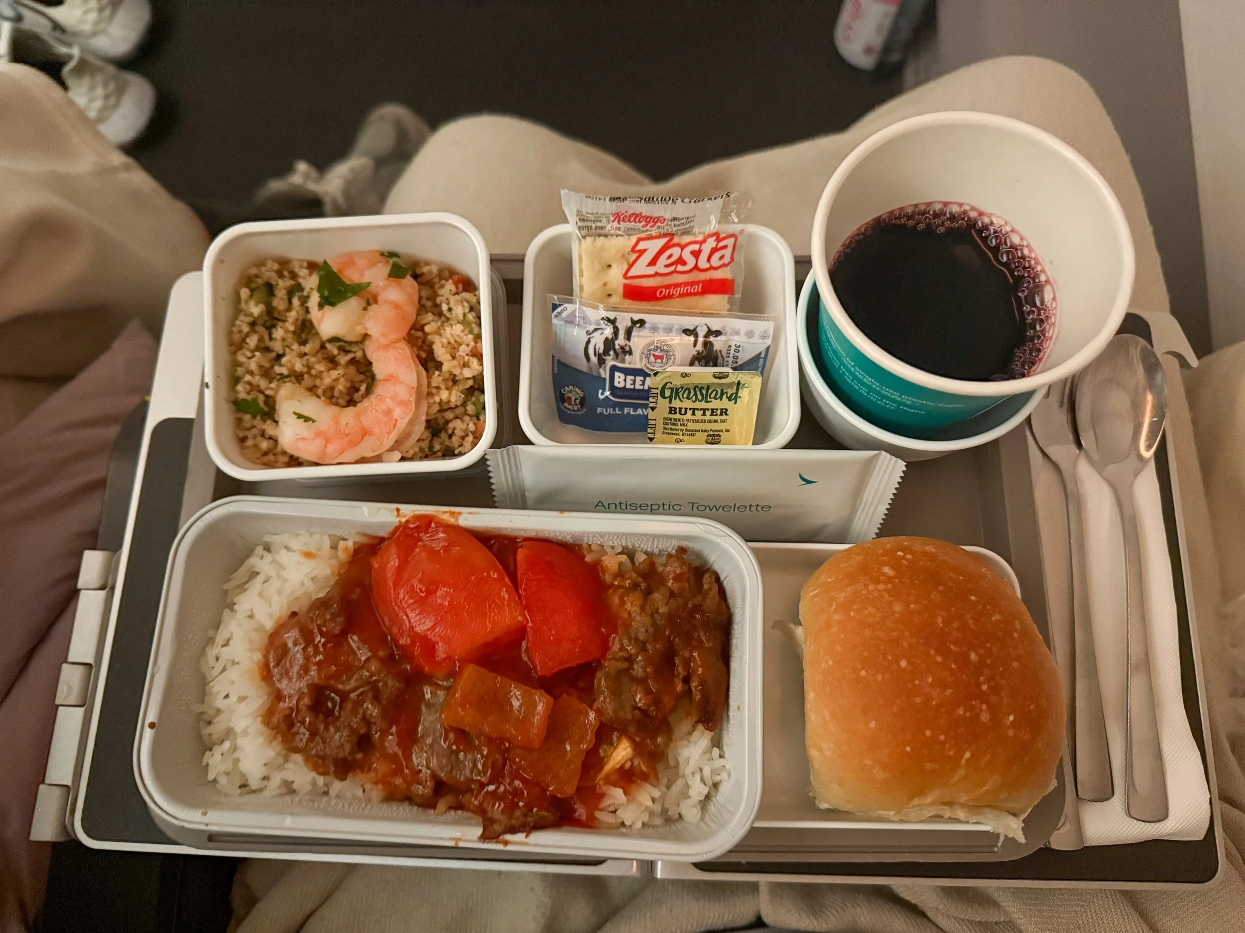 Dinner service on Cathay Pacific CX841 New York City to Hong Kong Economy Class. Image: James Hayes.