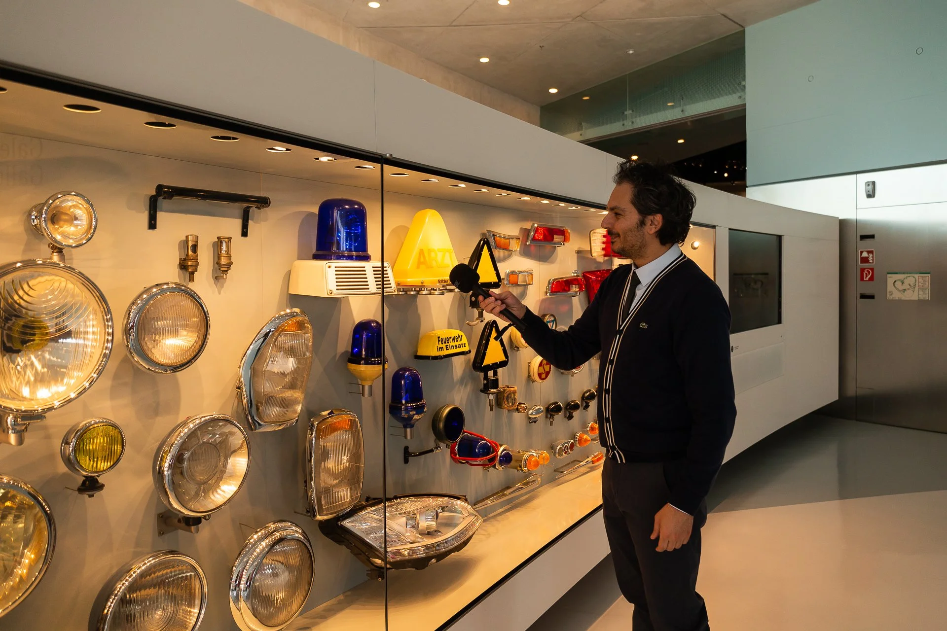 Writer Dan Latif encountering ephemera at the Mercedes-Benz Museum. Image: Julien Fautrat.