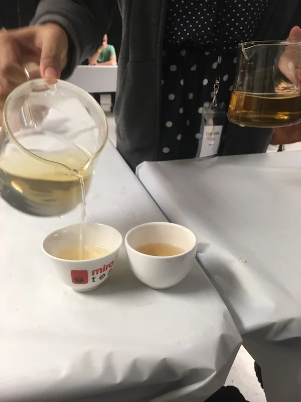 Rie Tulali (@teacurious) and I met at the World Tea Expo. She gives workshops at tea festivals around the US and at her home base in the Las Vegas metro area. Here, she is decanting the same green tea cupped for evaluation with two different kinds of water. The darker brewed tea (right) was brewed with Fuji bottled water which had nearly 150 TDS versus the local tap water at 38 TDS.