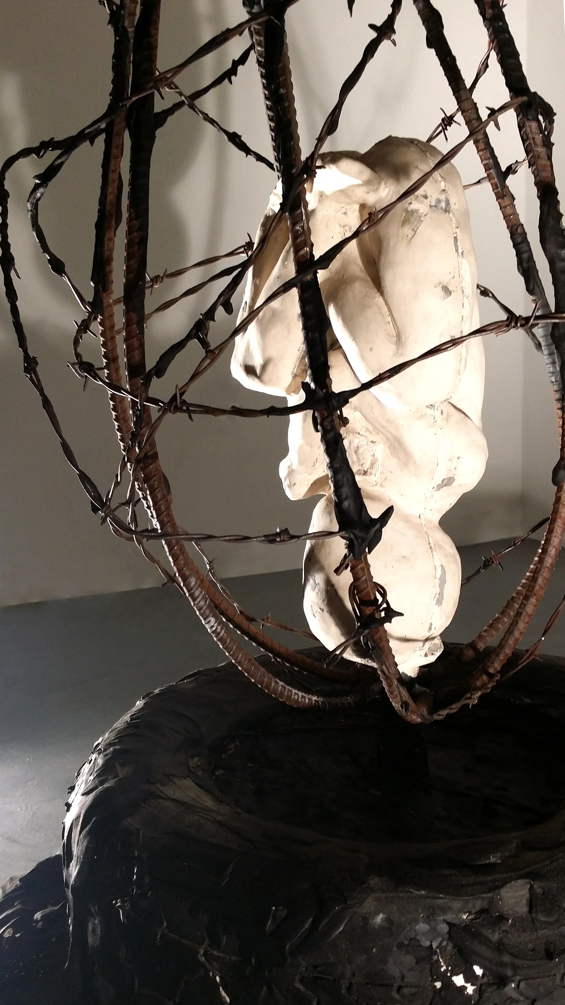  Create to Destroy, 2016,&nbsp;plaster, rebar, barbed wire, tire, tar 