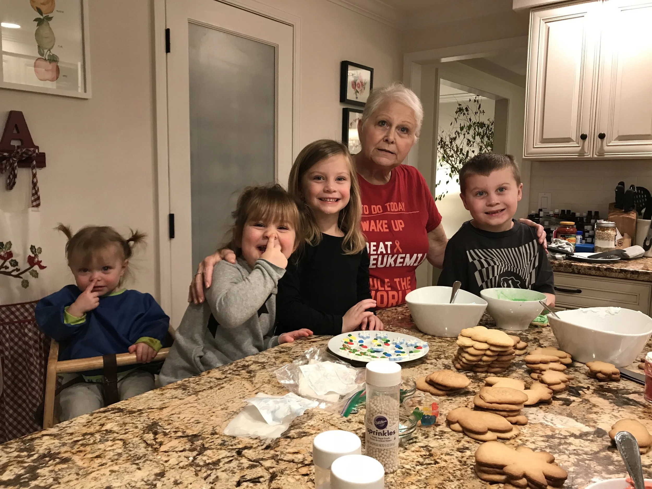 Norah, Winnie, Bella, and Baylor making cookies with Aunt Robin.