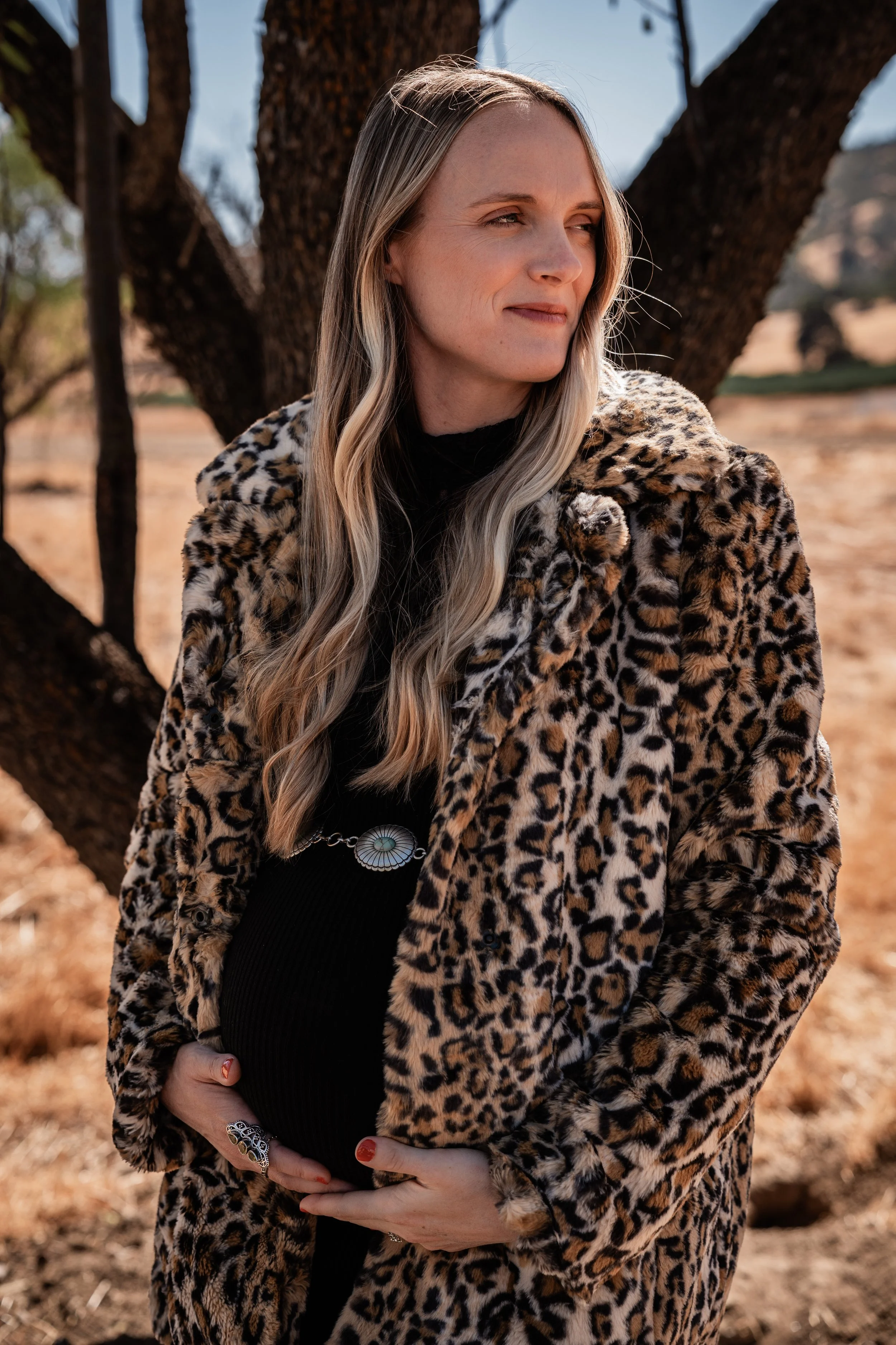 Pregnant woman posing with her baby bump in Capay, CA. Photo taken by maternity photographer, Mikaela Tosta Photography.