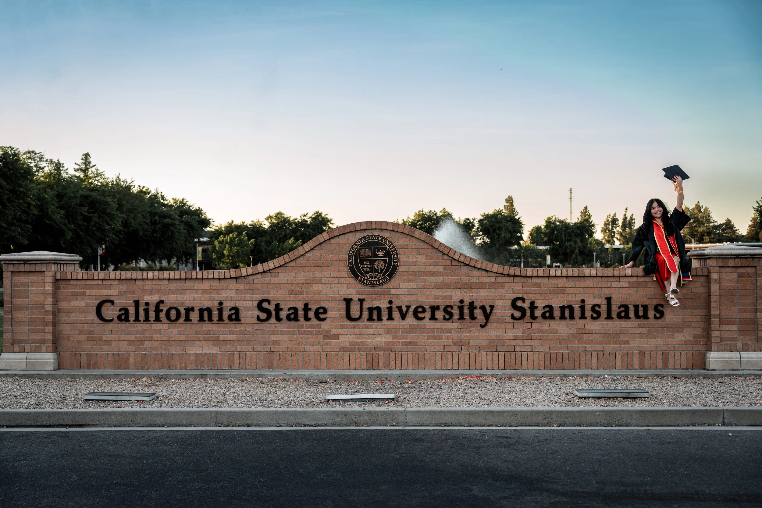 Photo of a Stanislaus State Graduate. Photo taken in Turlock, CA by senior photographer and grad photographer Mikaela Tosta Photography.