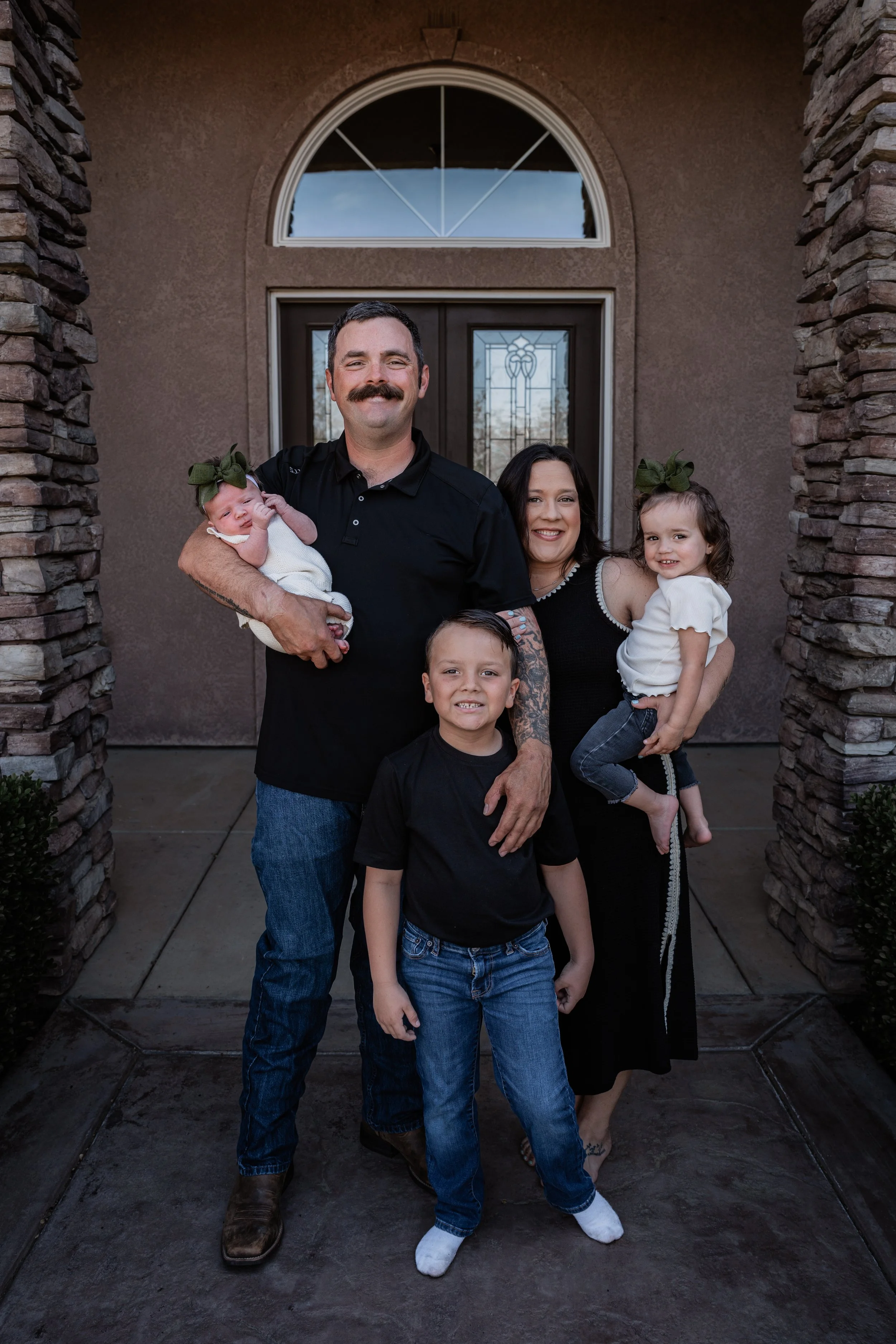 Family of 5 standing posing for a photo. Photo taken in Patterson, CA by local family photographer Mikaela Tosta Photography.