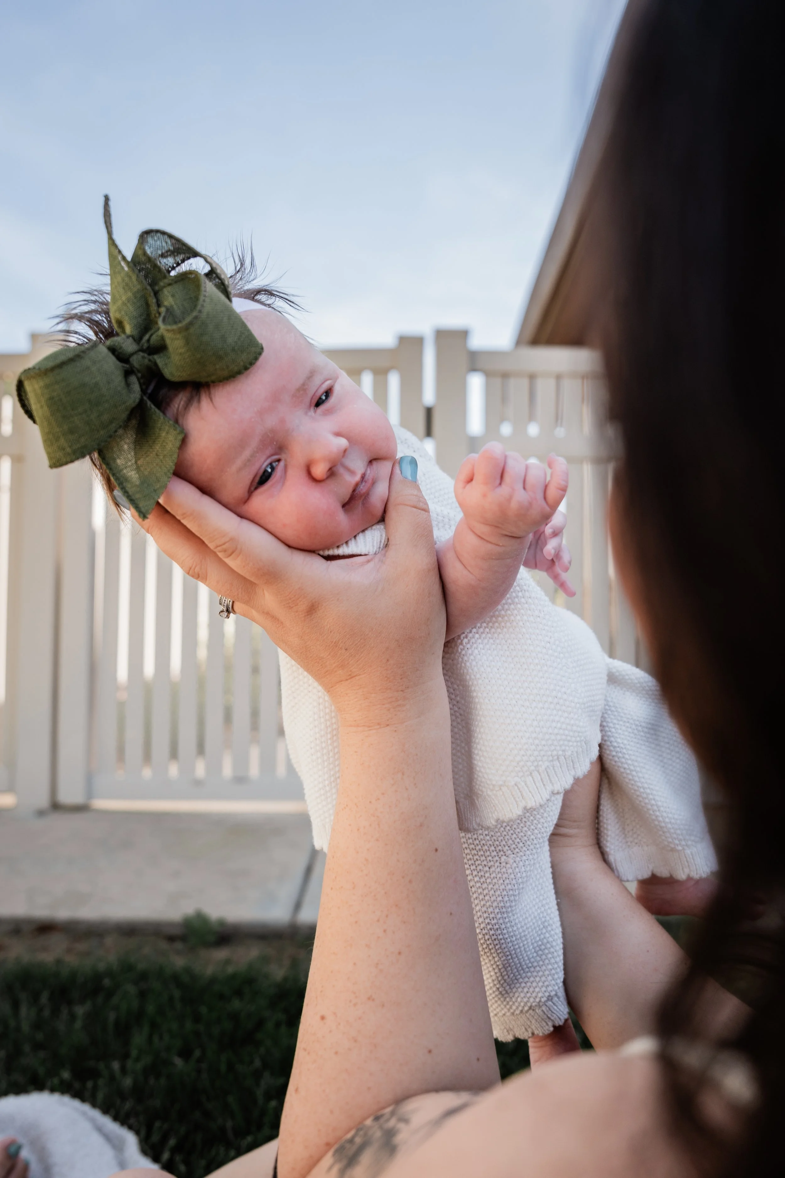 Baby girl looking at her mom. Photo taken in Patterson, CA by local family photographer Mikaela Tosta Photography.