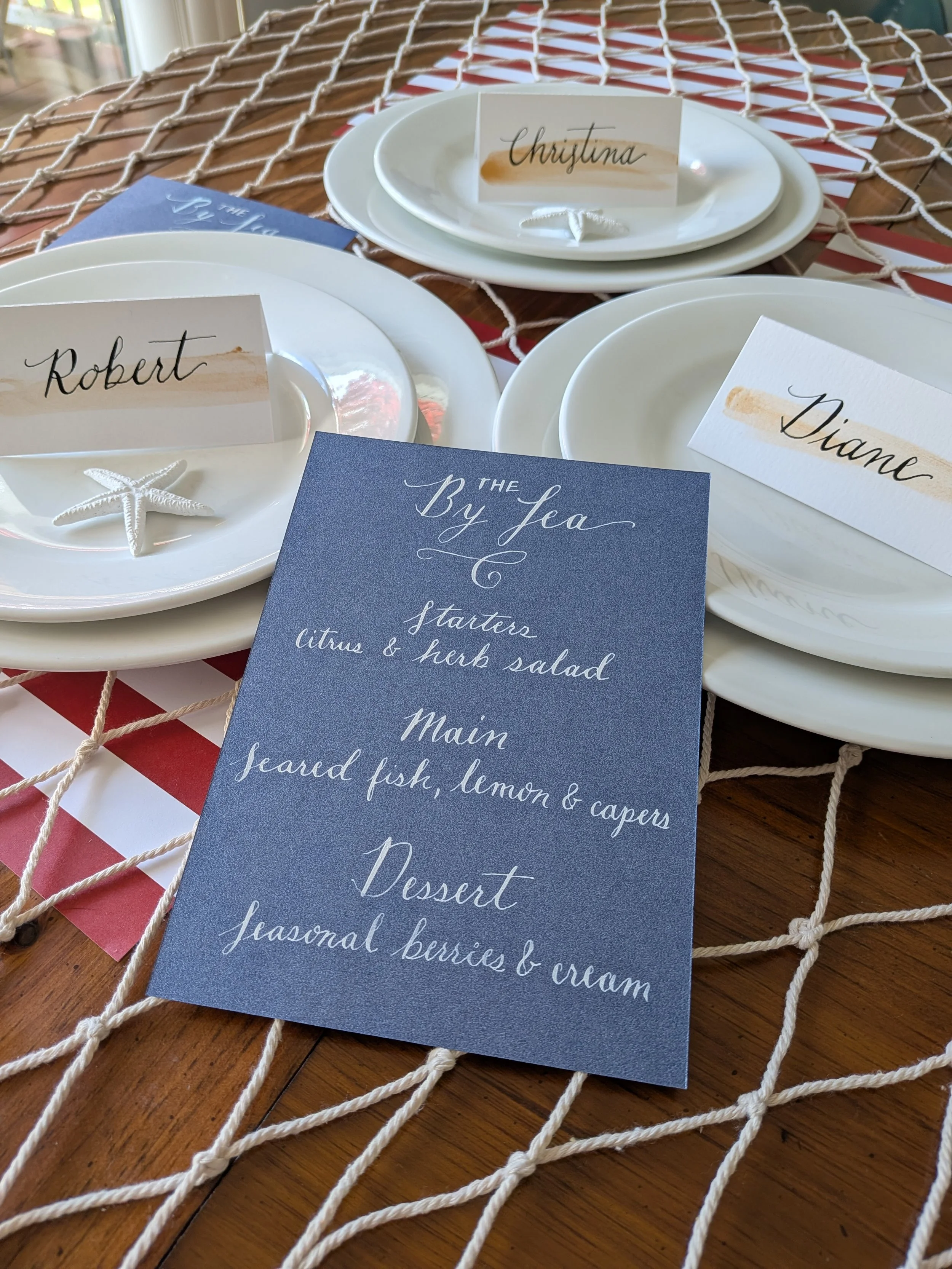calligraphy menu and handwritten place cards styled on coastal table setting for Rhode Island event