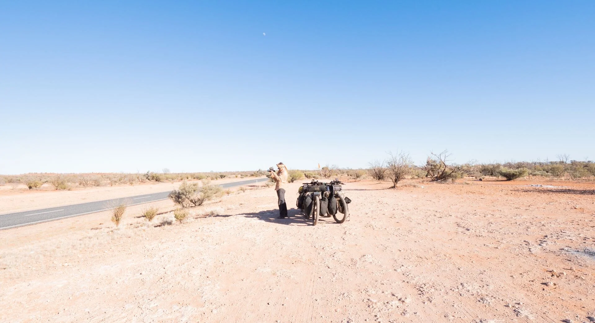  Balancing bikes on the Lasseter Highway as Brando stops to take a photo of Atila. 