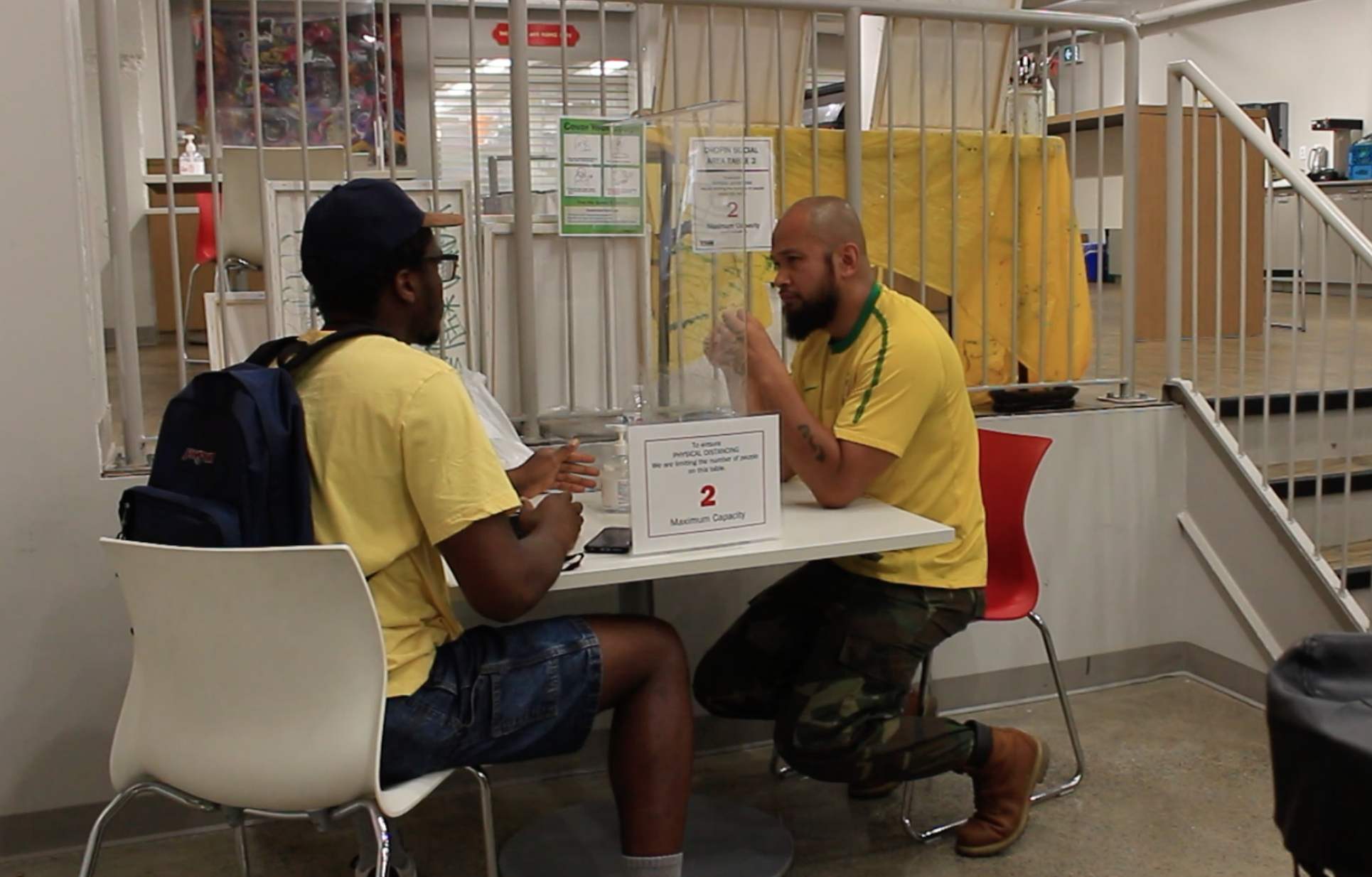 Dwight Catanus (right) is an outreach worker at Evergreen YSM. He is meeting with a client who had scheduled an appointment.