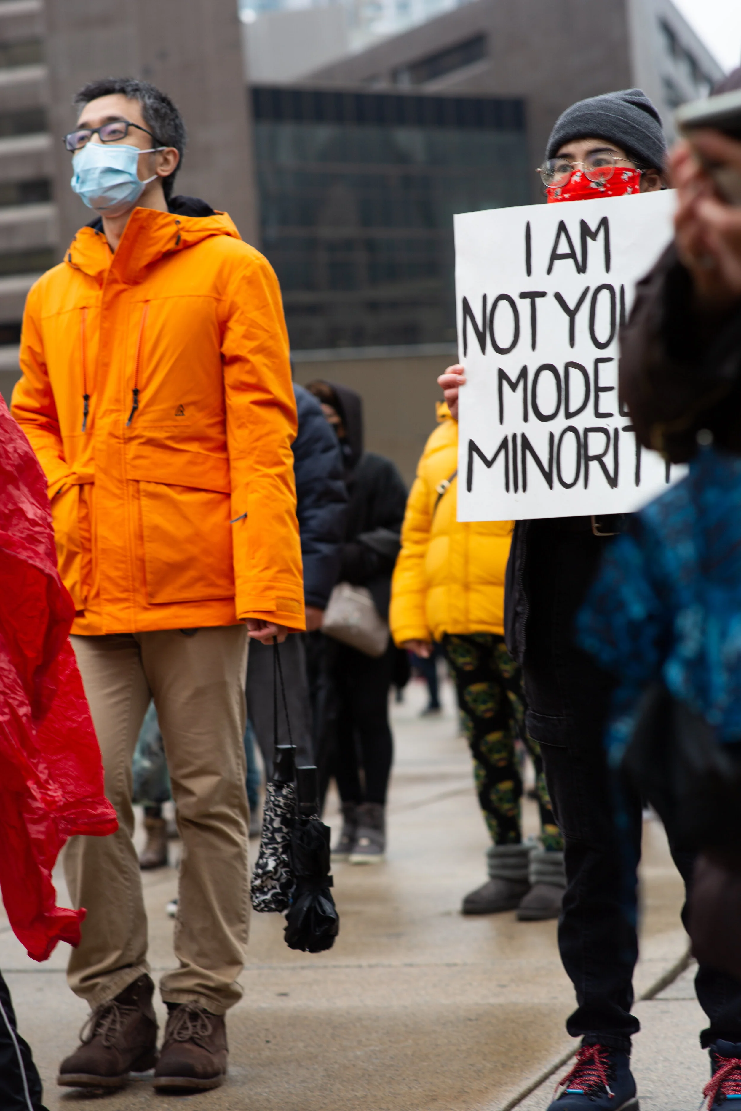 Protesters gather an hold signs in Nathan Phillip Square in Toronto for the Anti-Asian Hate protest in April. Photo cred: Johanna Hernandez