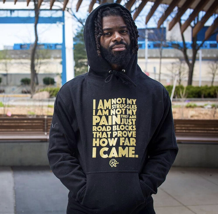 Randell Adjei photographed in his sweater that is a part of his clothing line. Photo by @mstoddart68