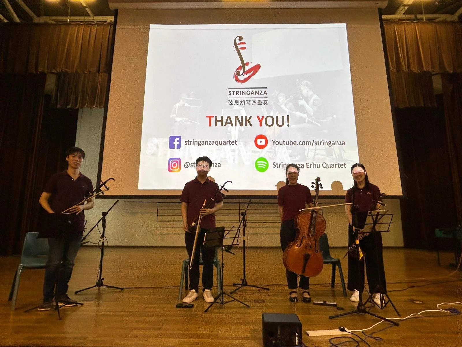 Stringanza musicians after an Arts Education Programme performance at a school