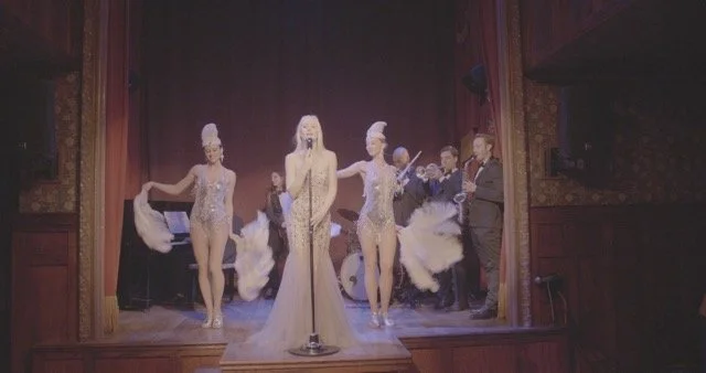 Feathers with singer and band.jpeg