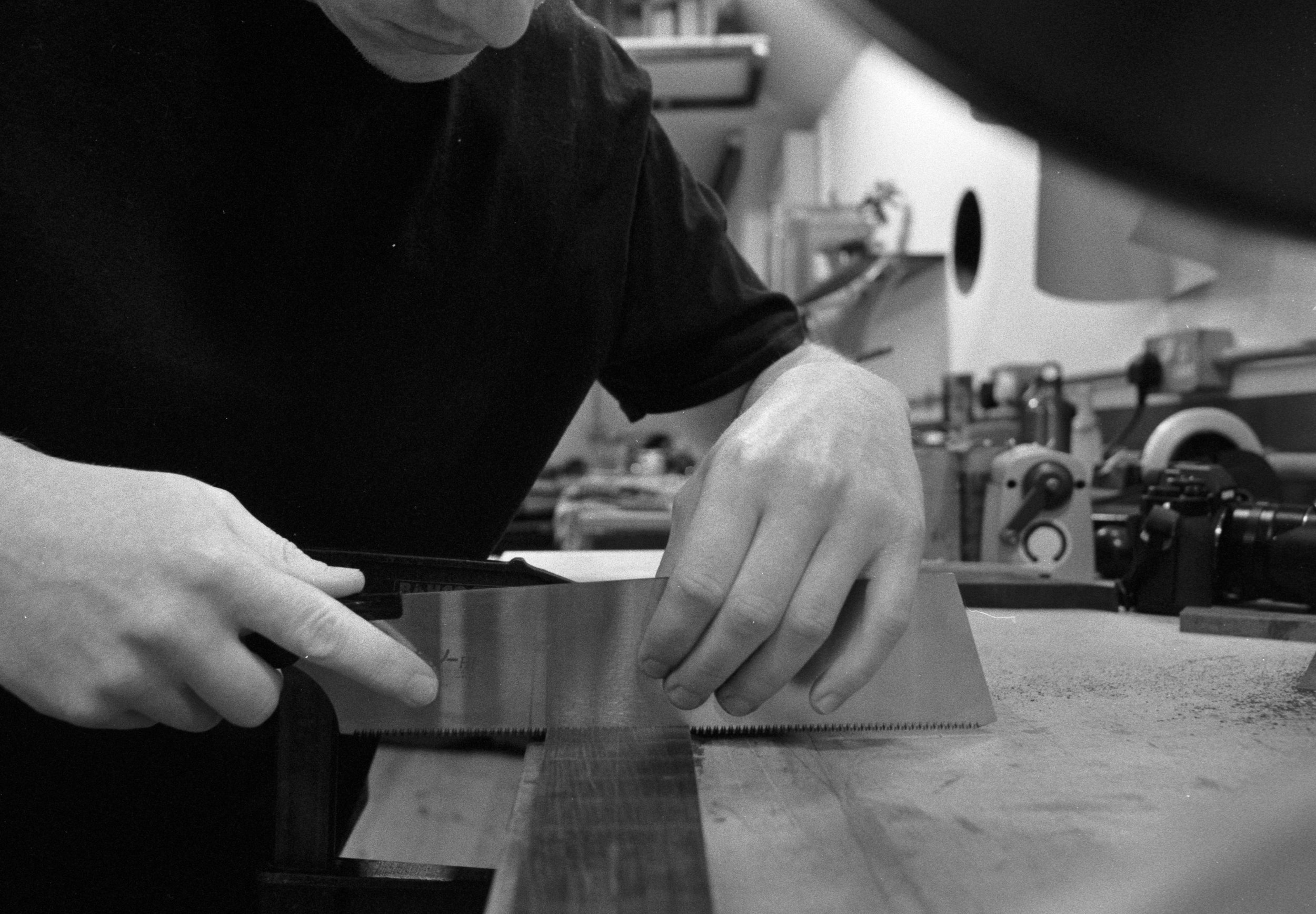  Caelin cutting fret slots in one of our 100% FSC African Blackwood fretboards 