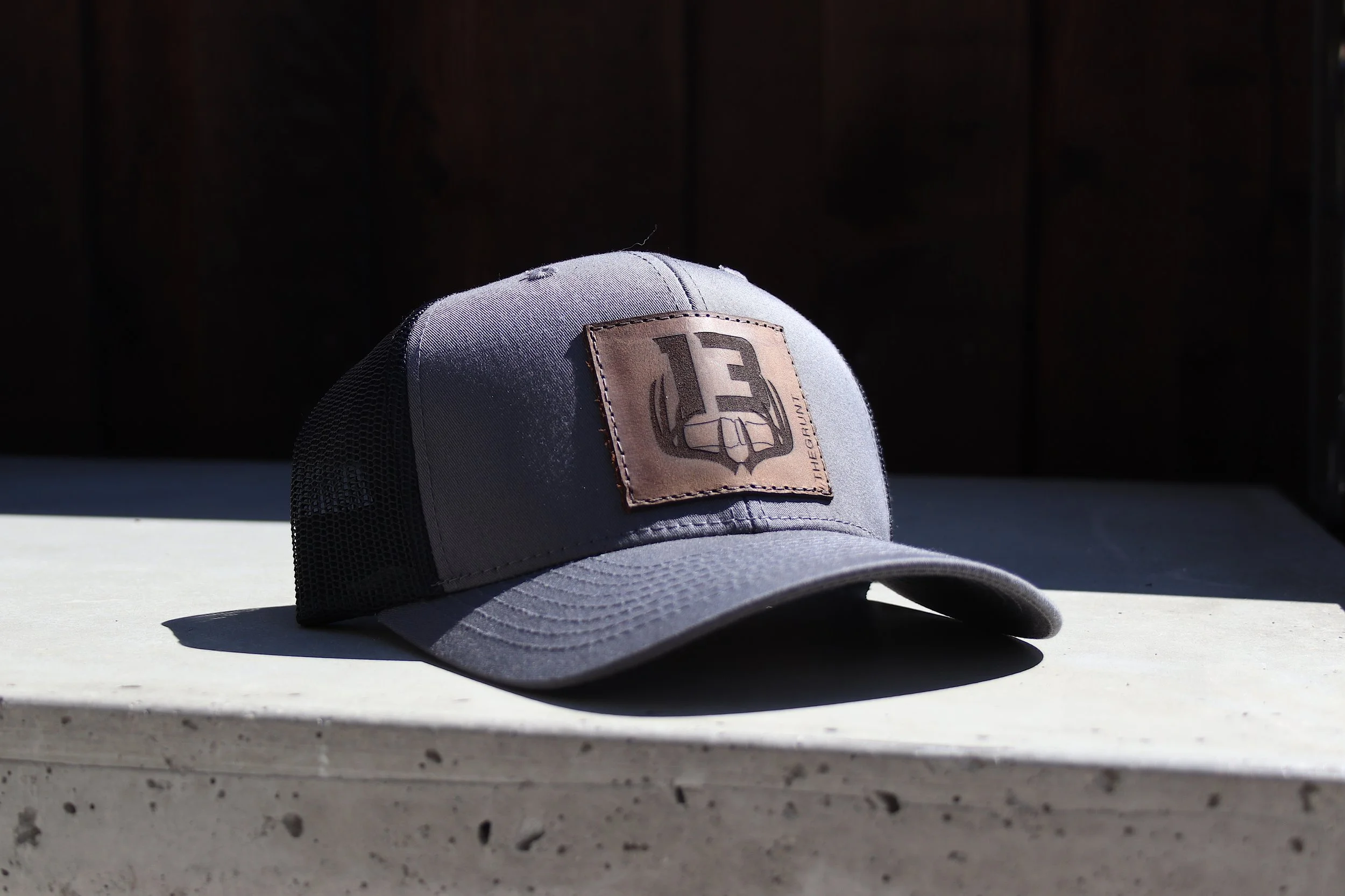 THE GRUNT - Leather Patch Trucker Hat (Grey/Black)