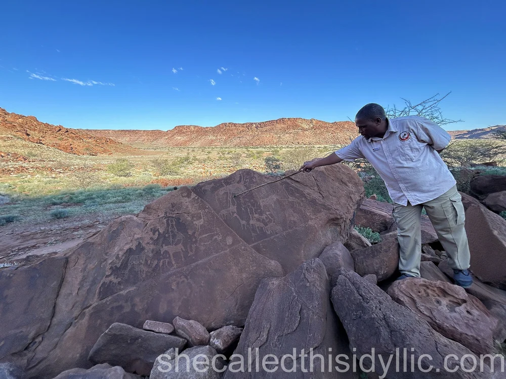 Guide at rock engravings at Twyfelfontaine