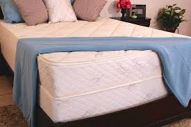 The USBoxspring Solid Wood Foundation , shown beneath the mattress above, is finished with an organic quilted covering that is easily installed.