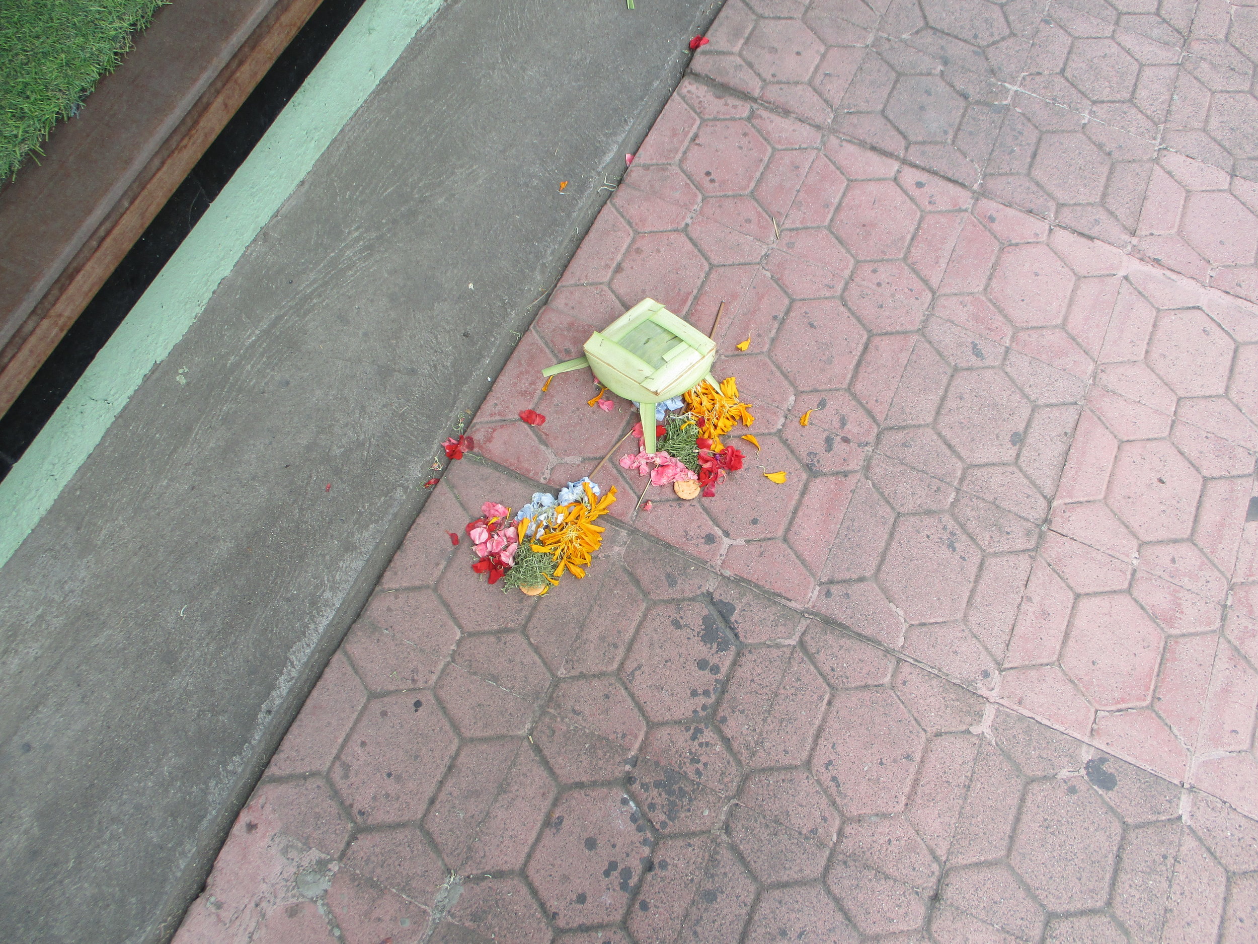 Canang (prayer offerings) on the pavement