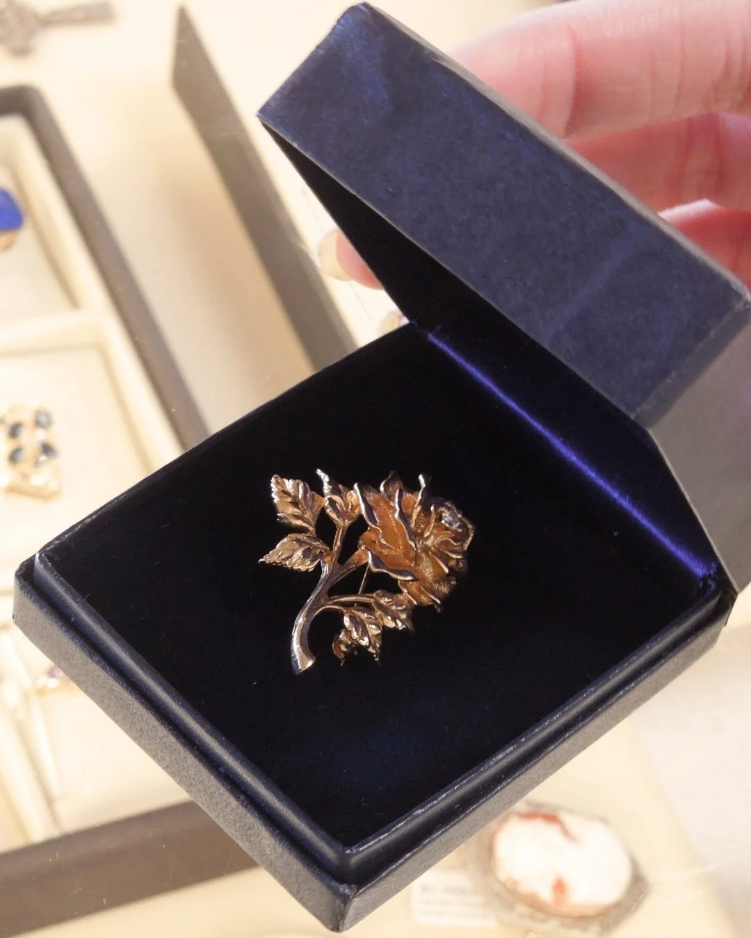 Our "new" item this week is actually quite old! This vintage flower brooch in 14K gold is by Tiffany &amp; Co and includes the original box. The classic and timeless rose design is accentuated by a sparkling diamond set in the center of the