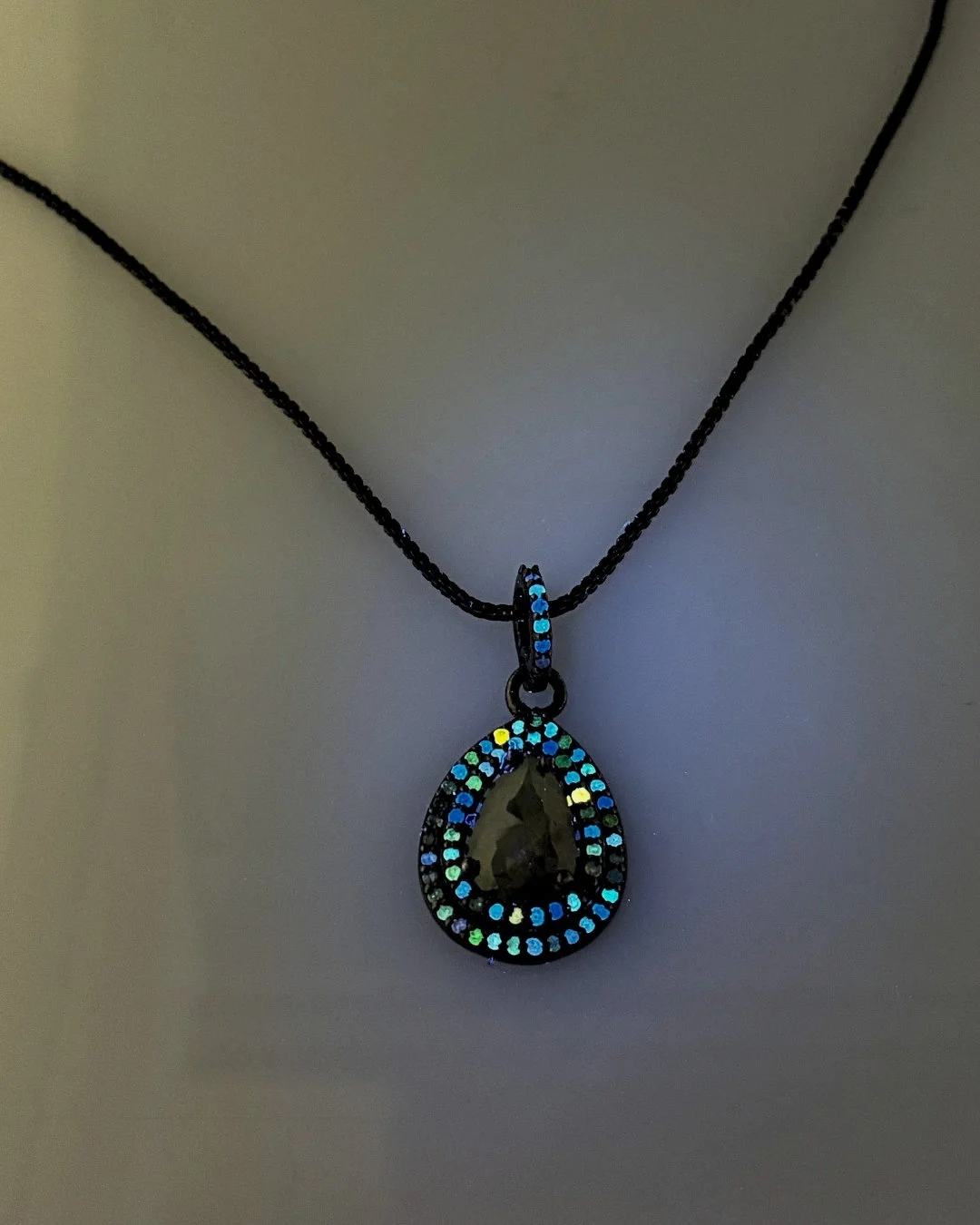 Fluorescence in diamonds refers to the stone's reaction to ultraviolet light, and while we most commonly see diamonds that display a blue color under UV light, other colors can occur as well. You would never expect that the champagne diamonds in this