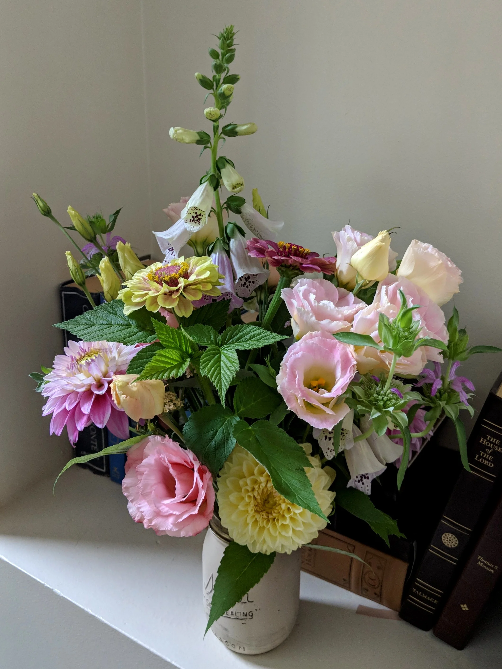 Raspberry foliage and summer blooms.