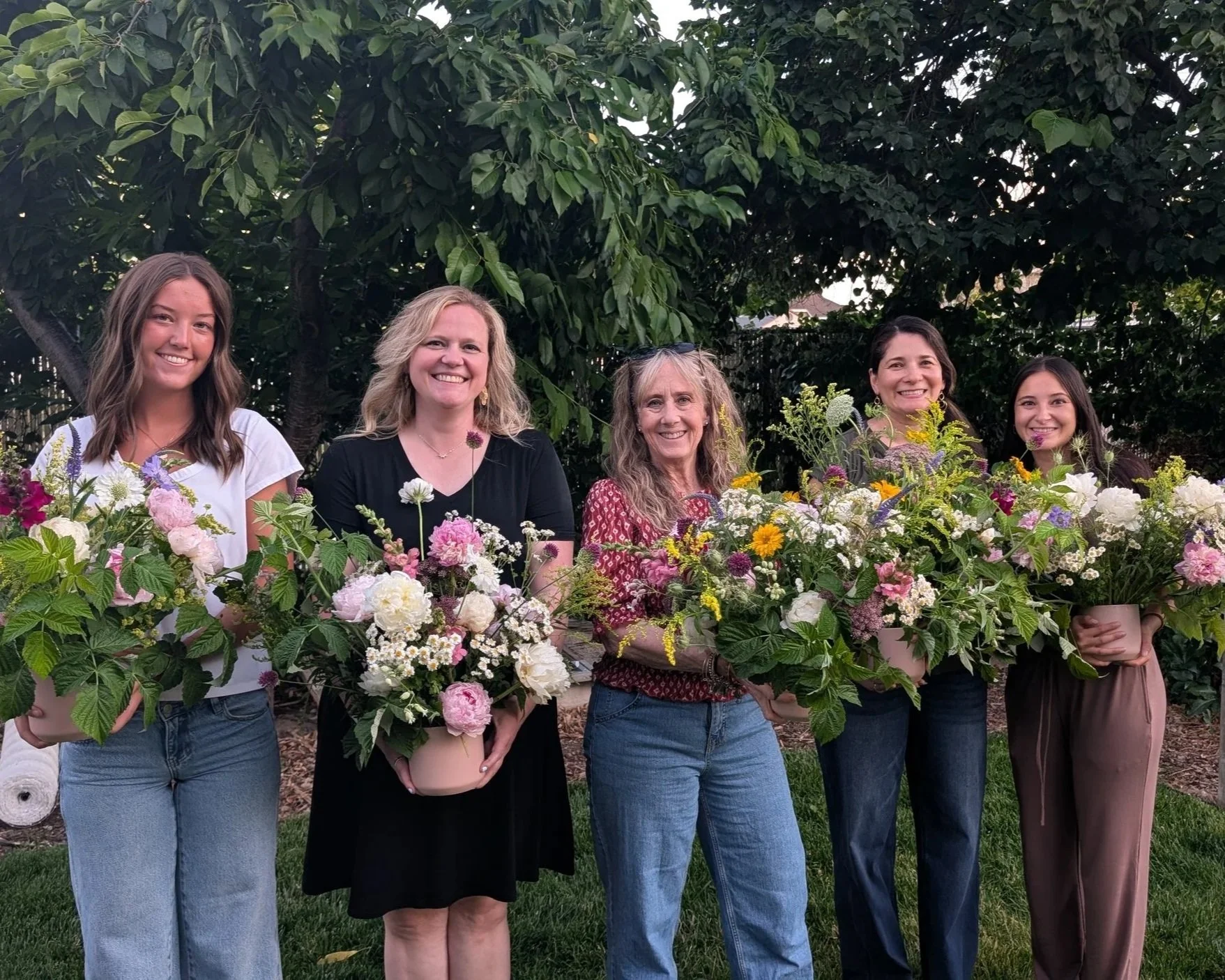 Workshop attendees with their peony arrangements