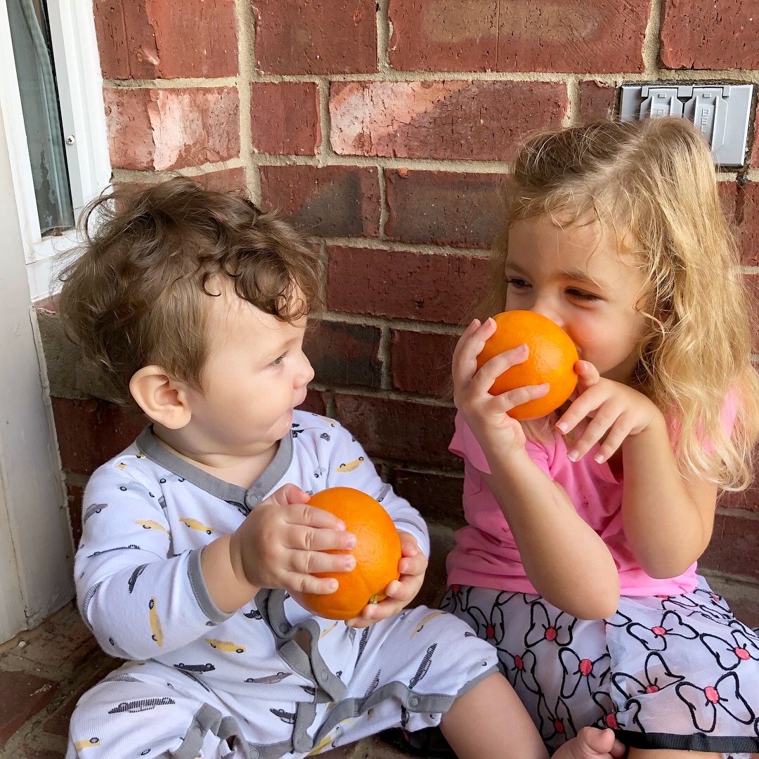 kids with oranges.jpg