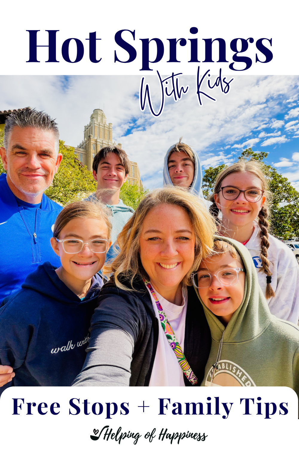 Family selfie in downtown Hot Springs, Arkansas, with a Pinterest graphic promoting free stops and family tips for visiting Hot Springs with kids.