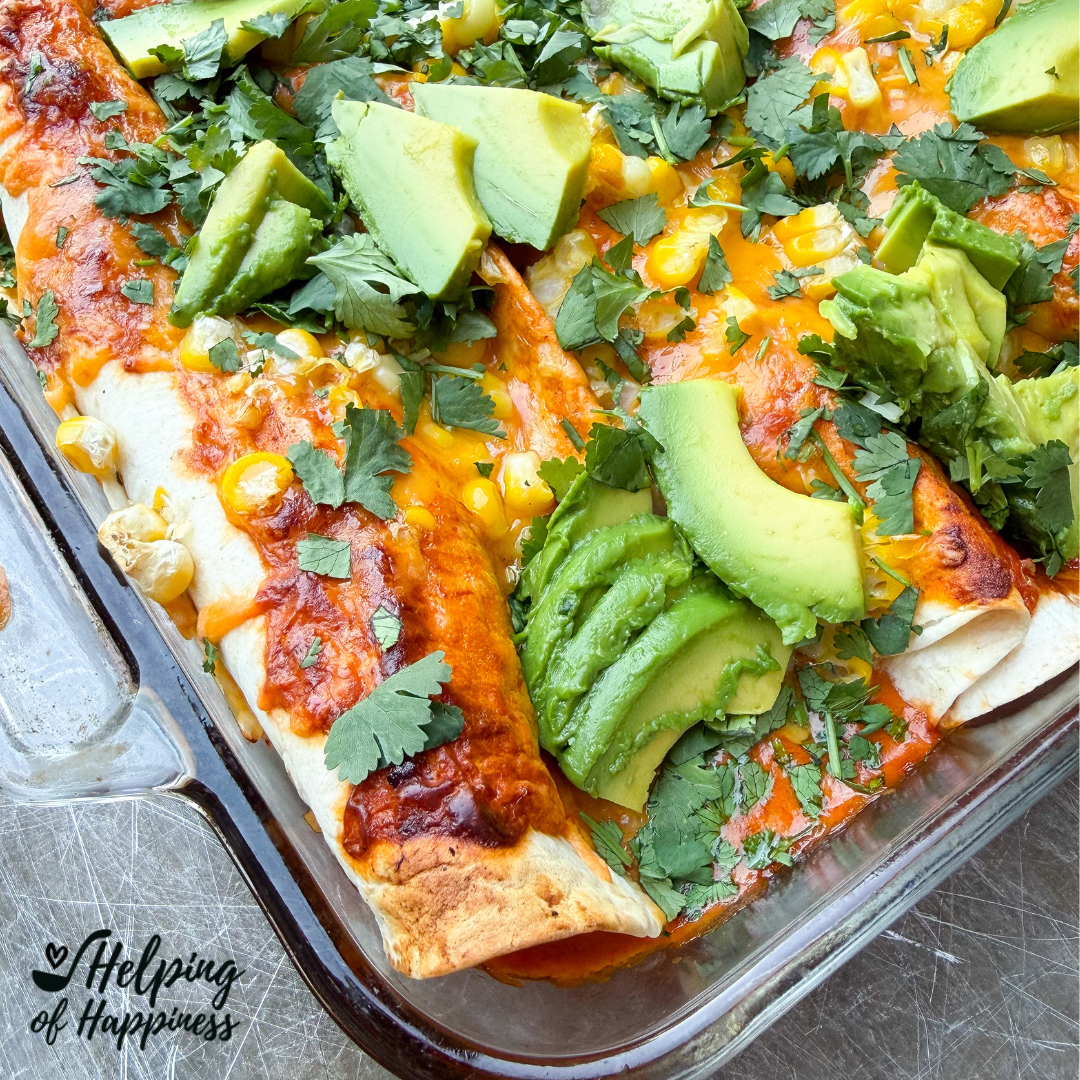 Loaded chicken enchiladas with honey lime chicken, red enchilada sauce and melted cheese in a baking dish